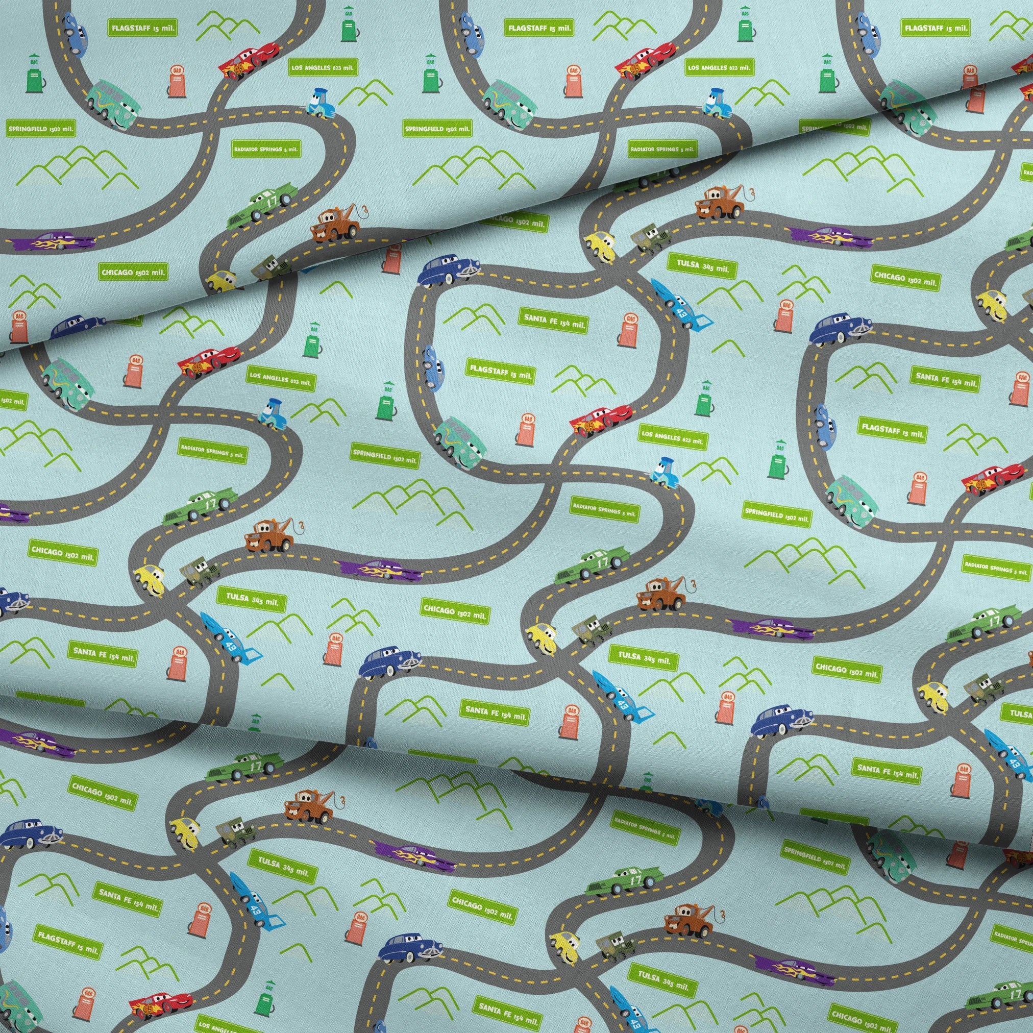 Cars from "Cars" movie on winding road with green speech bubbles showing different car brands and gas stations. fabric fold mockup
