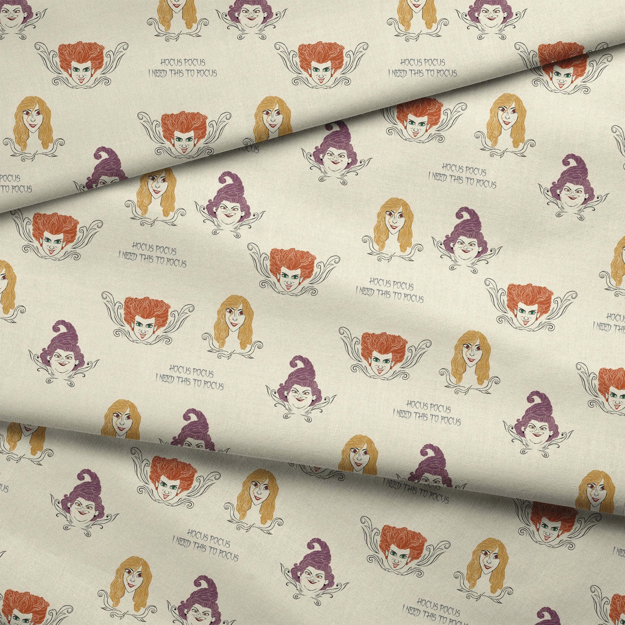 Pattern of illustrated magical characters with orange, blonde and purple hair on cream background with "Hocus Pocus" text fabric fold mockup