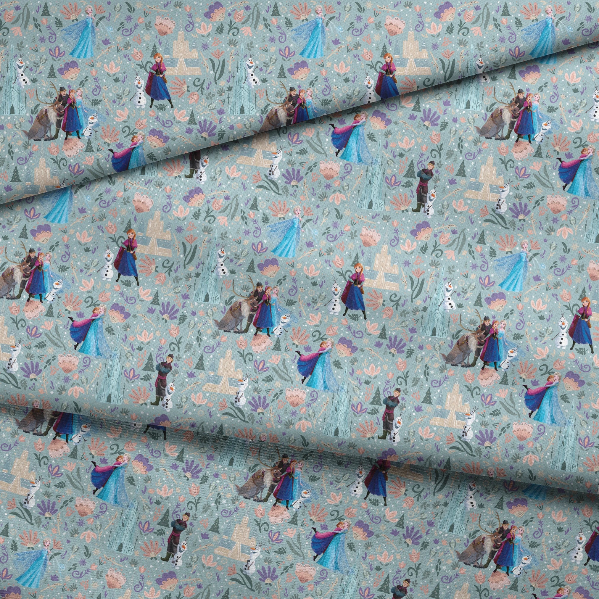 Frozen-themed pattern with the iconic characters, snowmen, flowers, and swirls on a light blue background fabric fold mockup