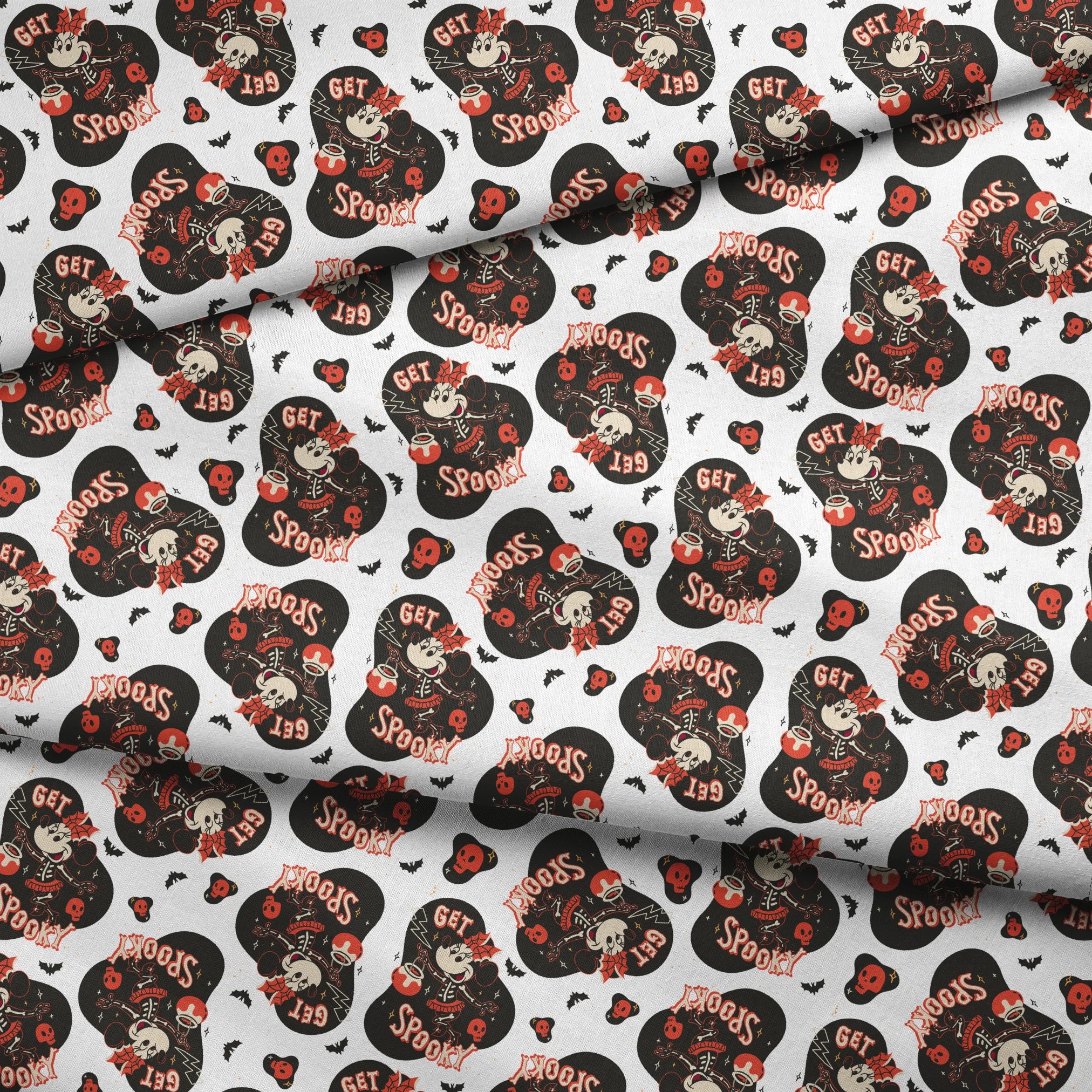 Halloween pattern with Minnie Mouse shapes, "Get Spooky" text, skulls, bats, and hearts on white background fabric fold mockup