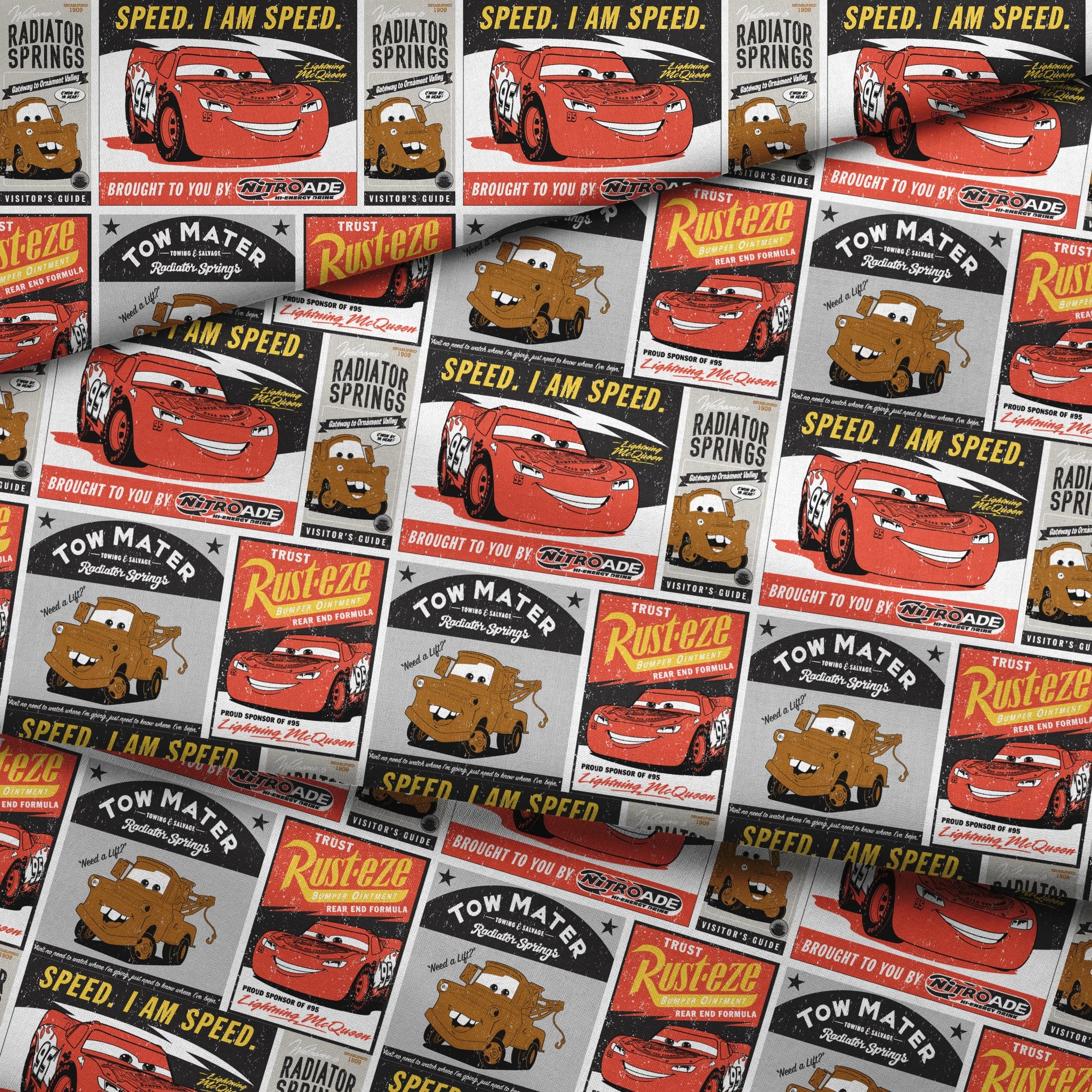Cars merchandise posters featuring red race car saying "Speed. I am speed." and brown tow truck character with "Tow Mater" in vintage advertising style fabric fold mockup