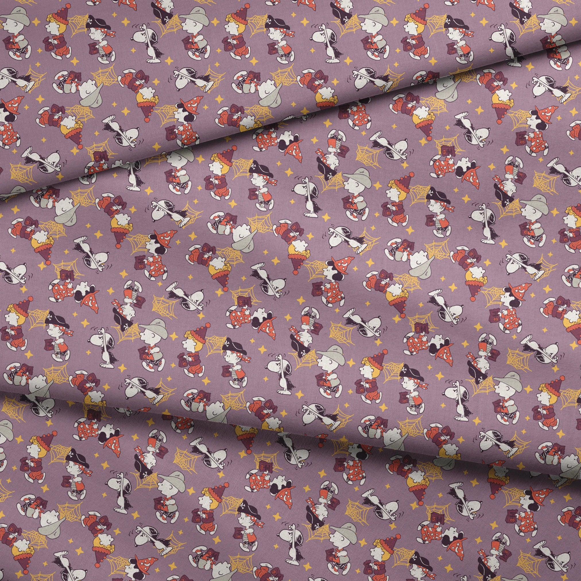 Snoopy and Peanuts characters in fall outfits with pumpkins and stars on purple background fabric fold mockup