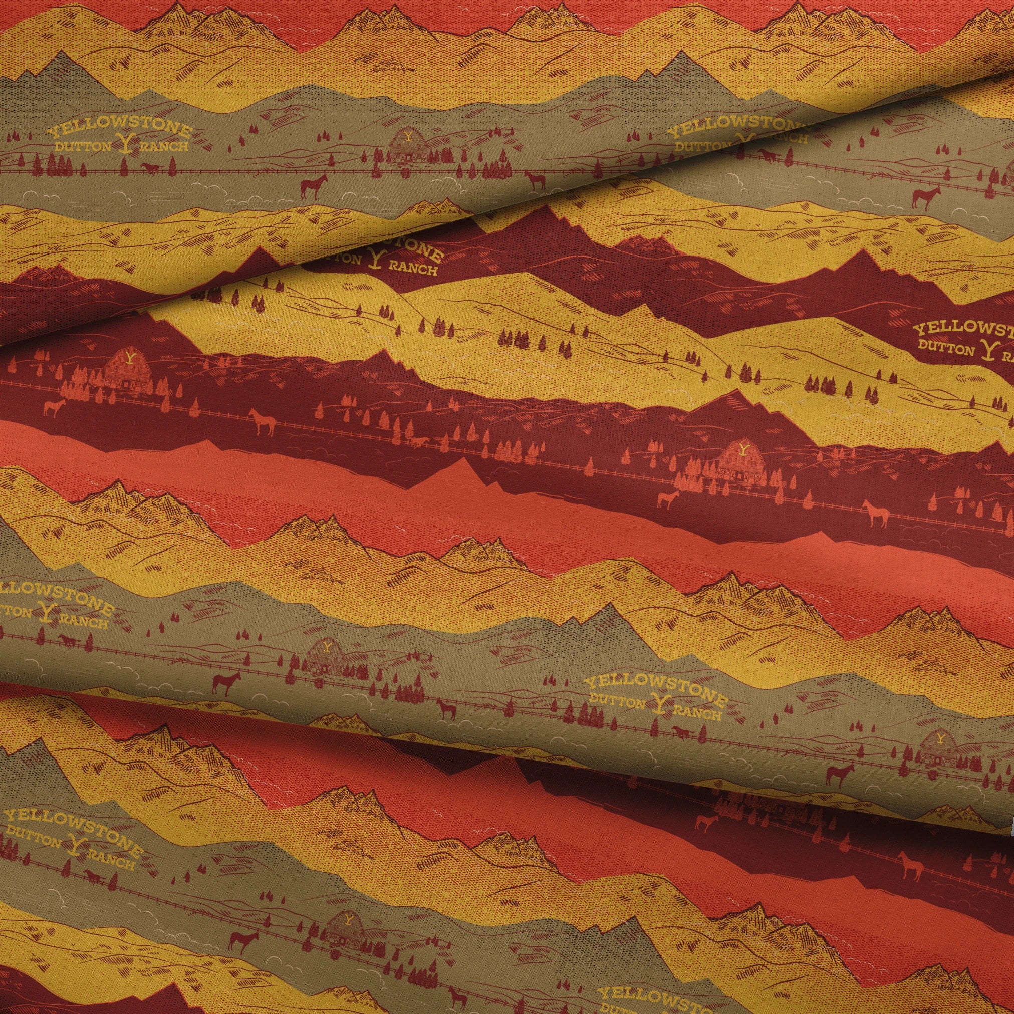 Layered mountain landscape in red, gold, and brown with "Yellowstone Cotton Ranch" text and silhouetted trees and wildlife. fabric fold mockup