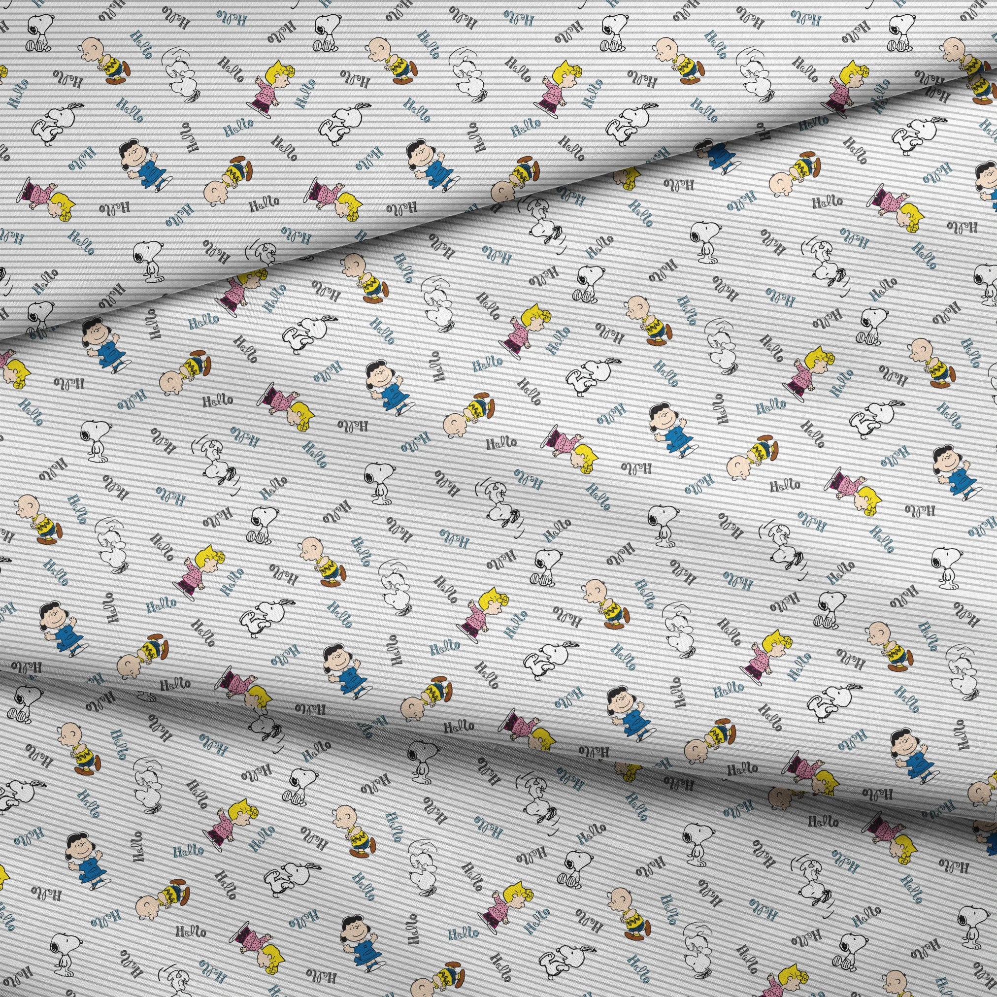 Peanuts cartoon characters scattered on striped background with "hello" text, featuring Snoopy, Charlie Brown, and friends fabric fold mockup