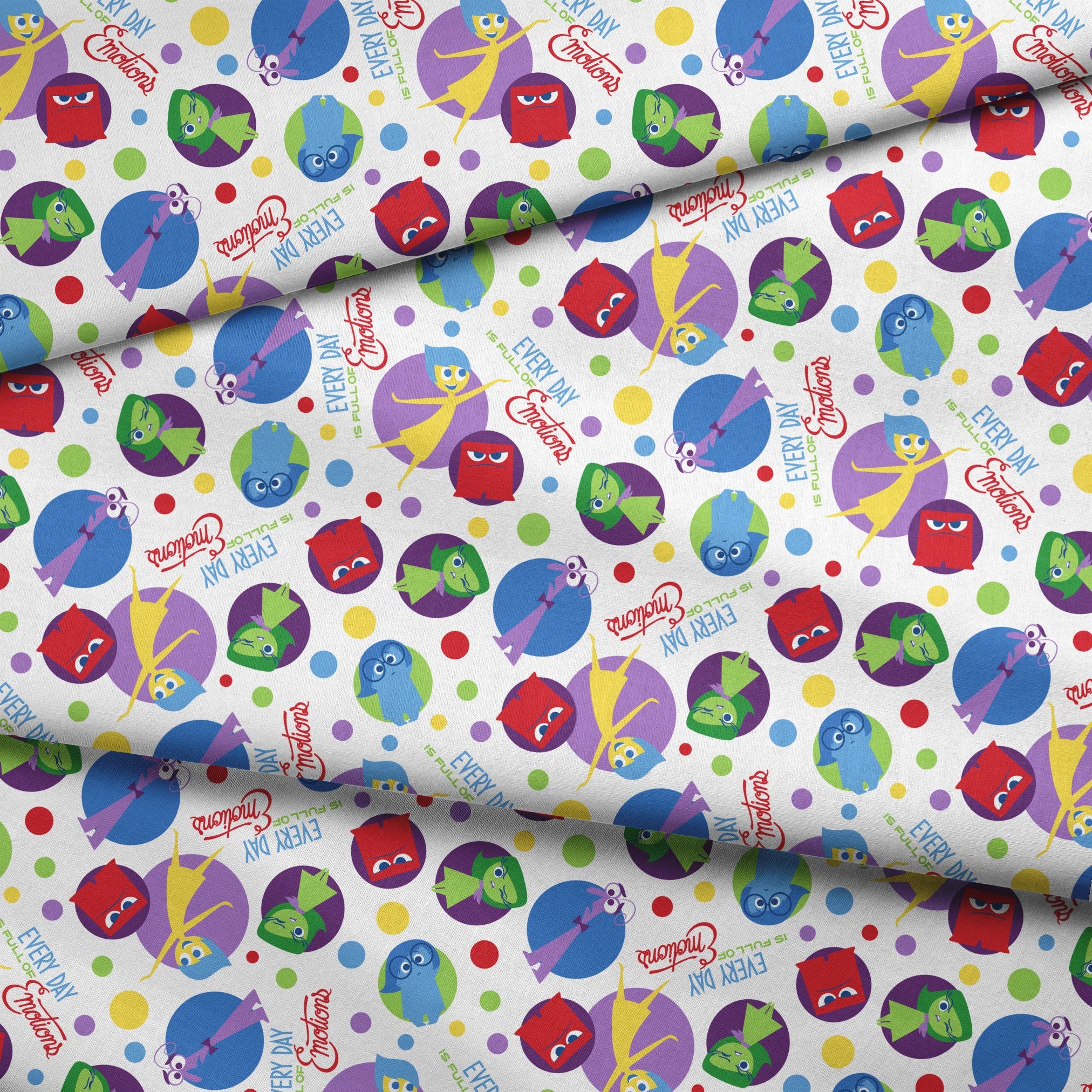 Colorful Inside Out characters in circles - Joy, Sadness, Fear, Disgust, and Anger on polka dot background fabric fold mockup