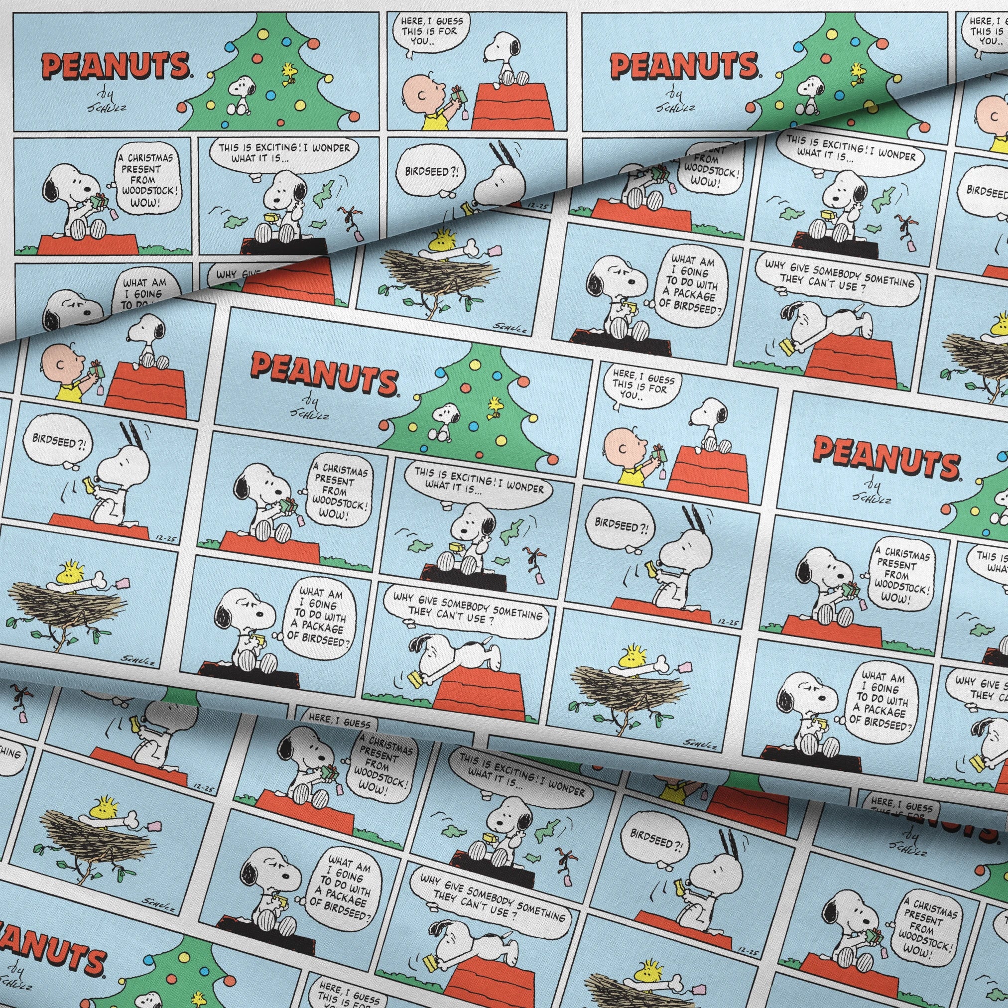 This is a Peanuts comic strip featuring Snoopy on his red doghouse with a Christmas tree visible. The panels show Snoopy preparing and decorating his doghouse for the holidays, with his yellow bird friend Woodstock appearing in a nest with Christmas lights. fabric fold mockup