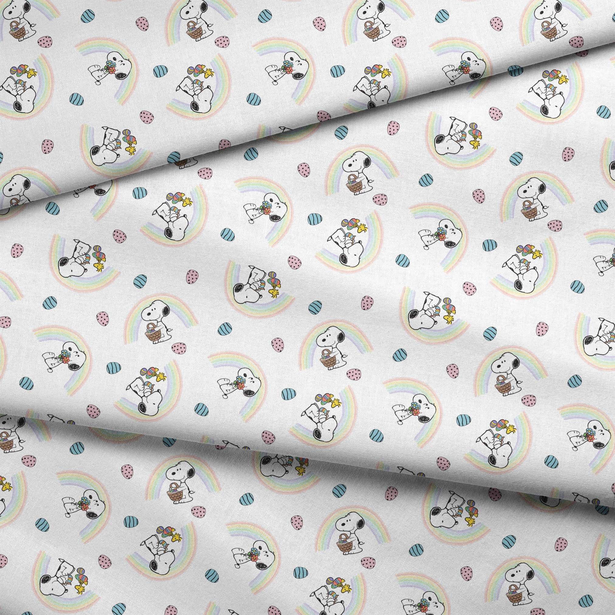 Snoopy pattern with Easter eggs, rainbows, and Woodstock, featuring Snoopy holding flowers and baskets fabric fold mockup