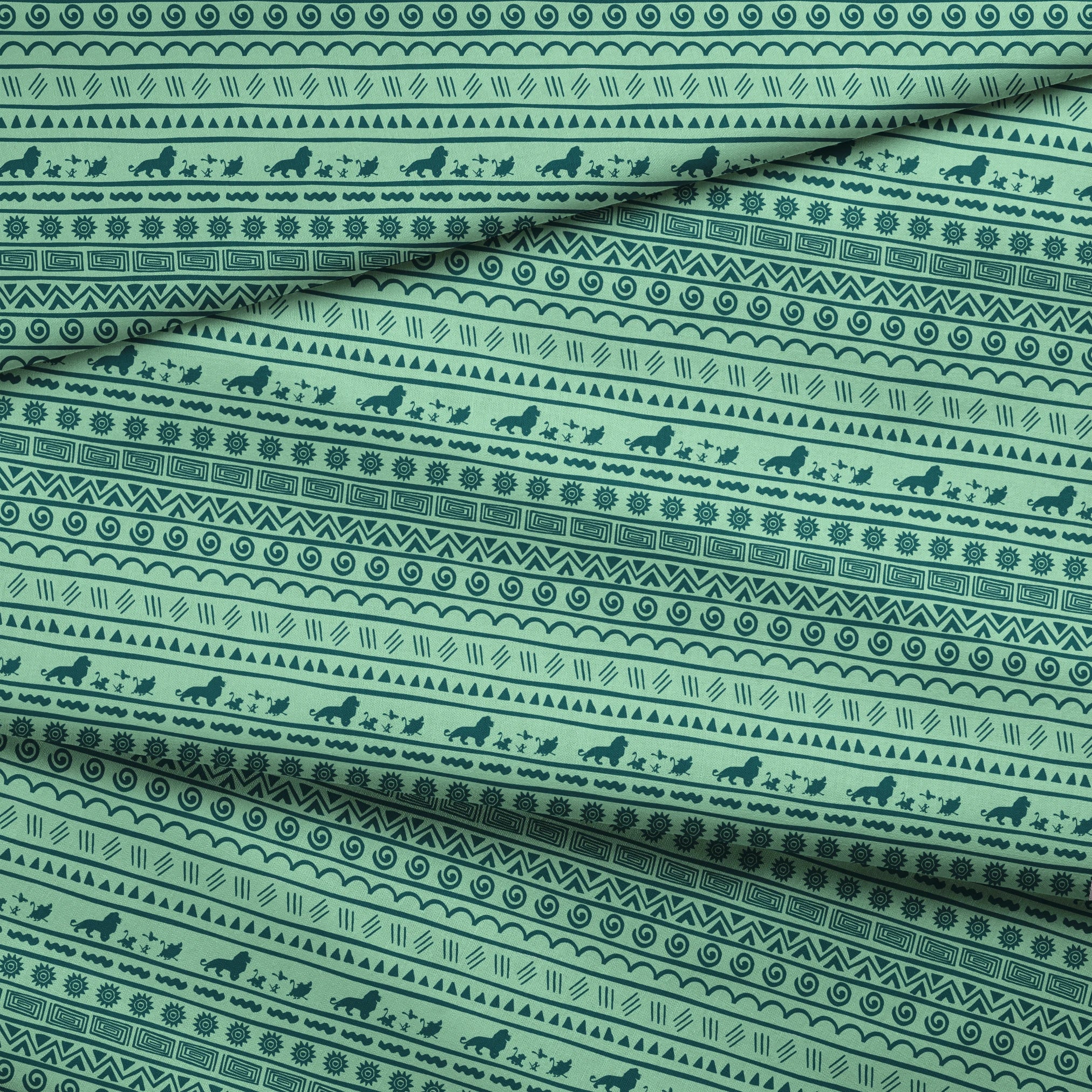 Traditional African-inspired pattern in dark teal on mint green with lions, spirals, triangles, and geometric motifs fabric fold mockup
