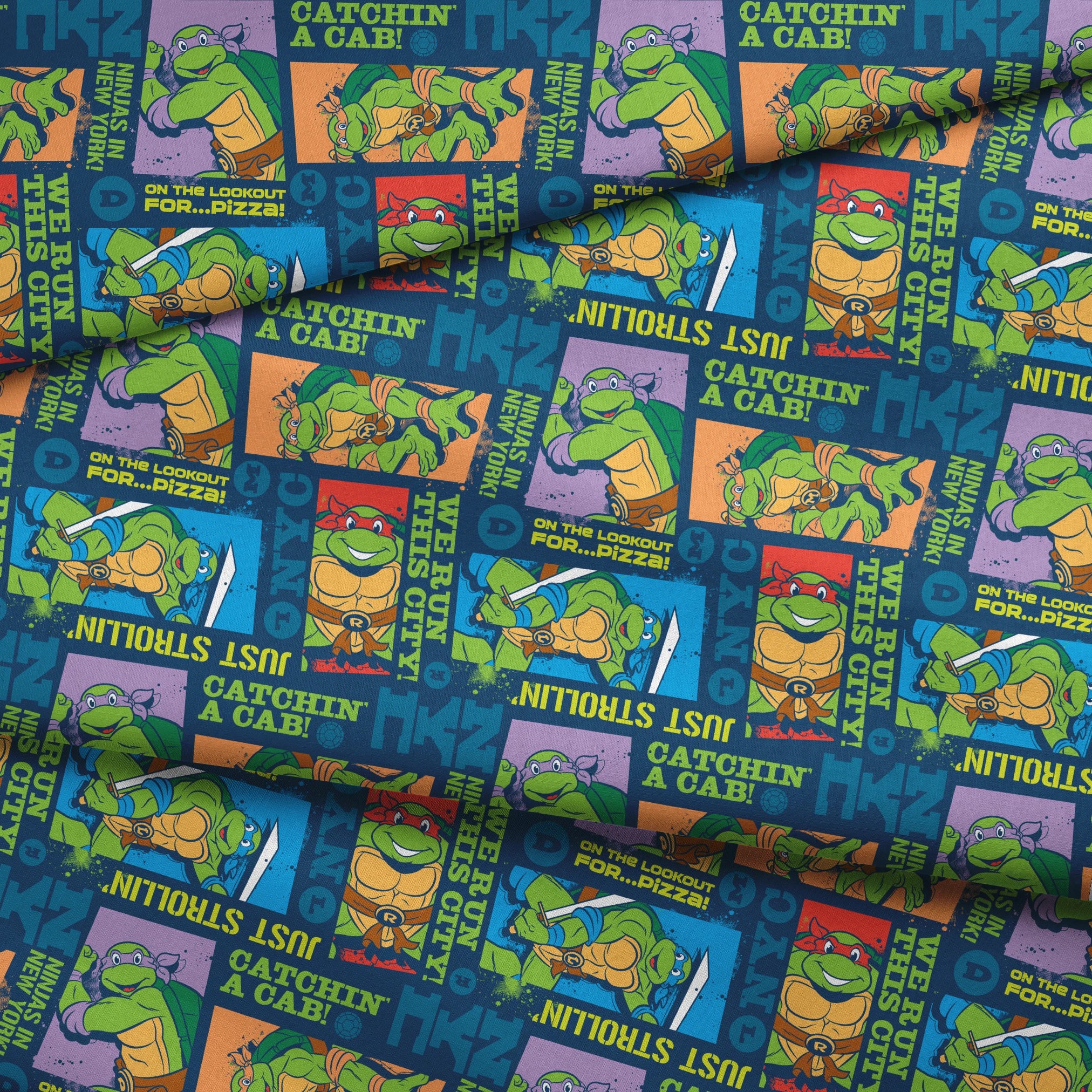 Teenage Mutant Ninja Turtles comic-style panels with characters in action poses and phrases like "Catchin' a Cab!" and "On the Lookout for Pizza! fabric fold mockup