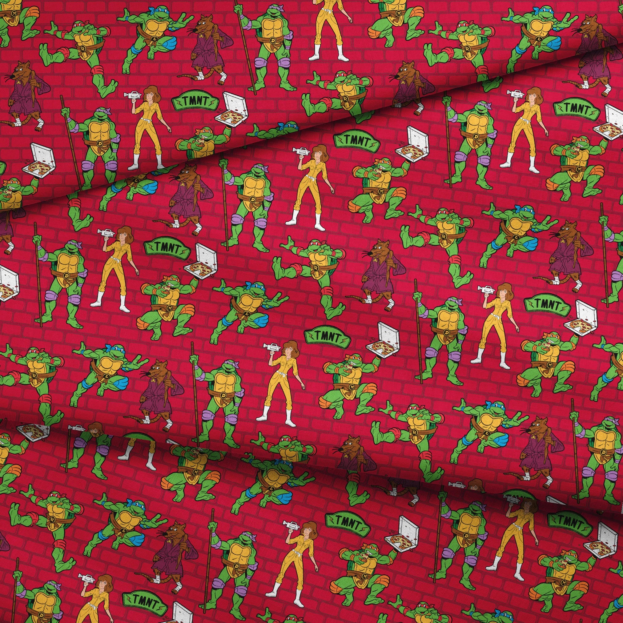Teenage Mutant Ninja Turtles pattern on red background with green turtle characters in action poses fabric fold mockup