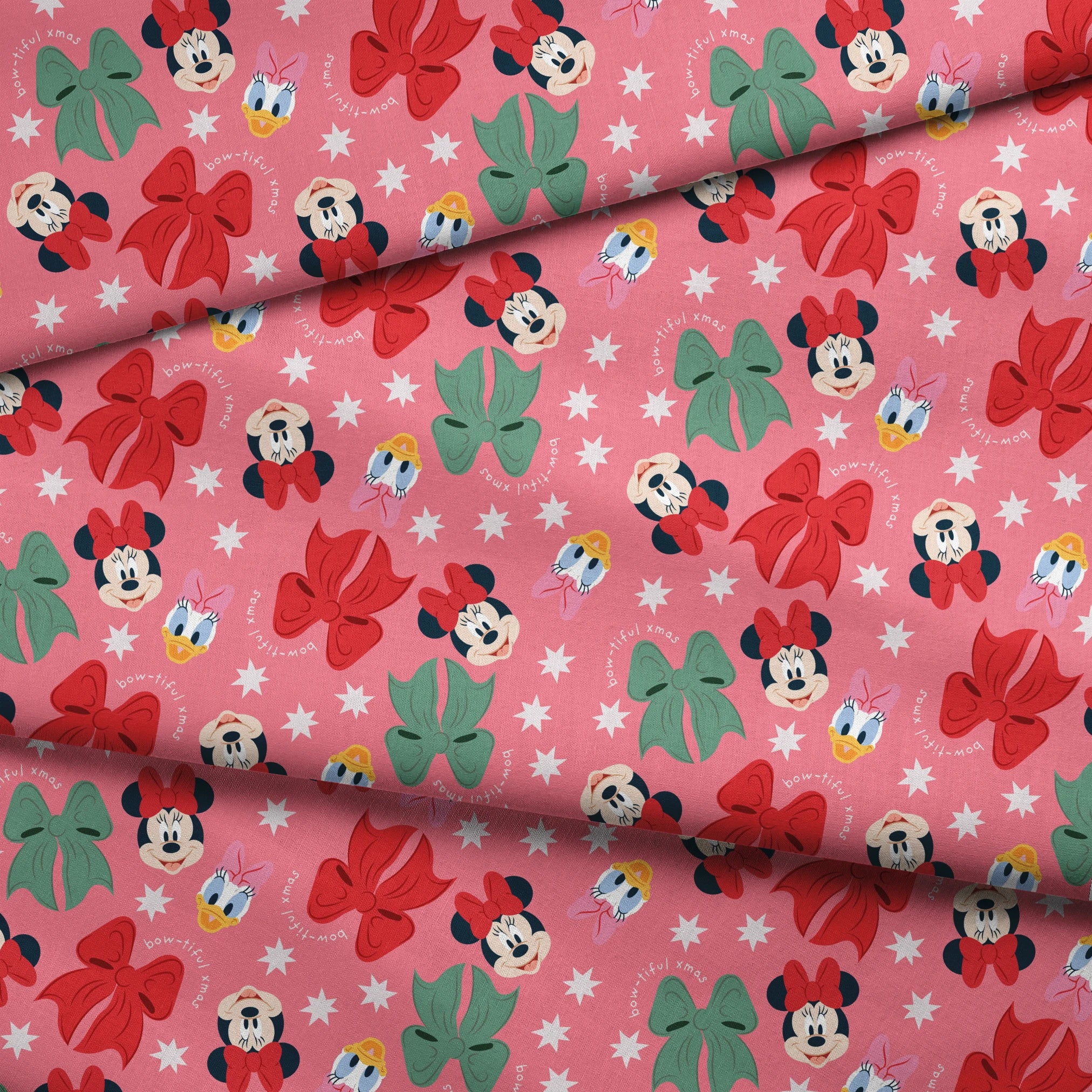 Disney character pattern with Mickey and Minnie Mouse, Donald Duck, bows in red and green on pink background with white stars fabric fold mockup