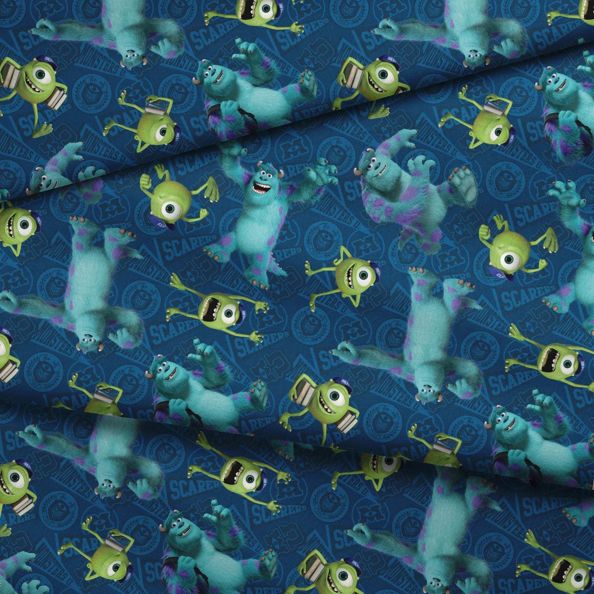 Monsters Inc characters pattern with Mike Wazowski and Sully on blue background fabric fold mockup