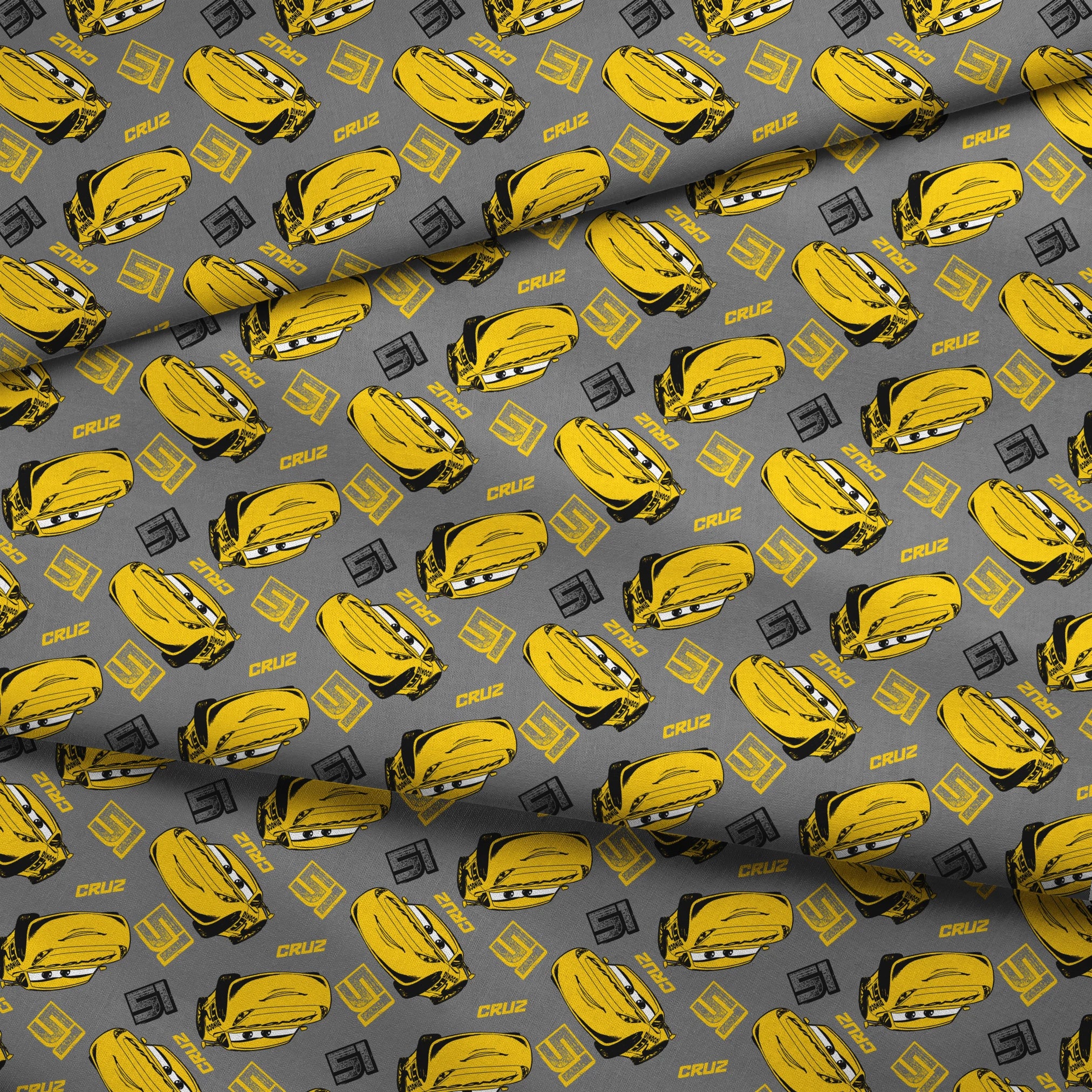 Yellow cartoon race cars with Cruz name on gray background, Cars movie pattern fabric fold mockup