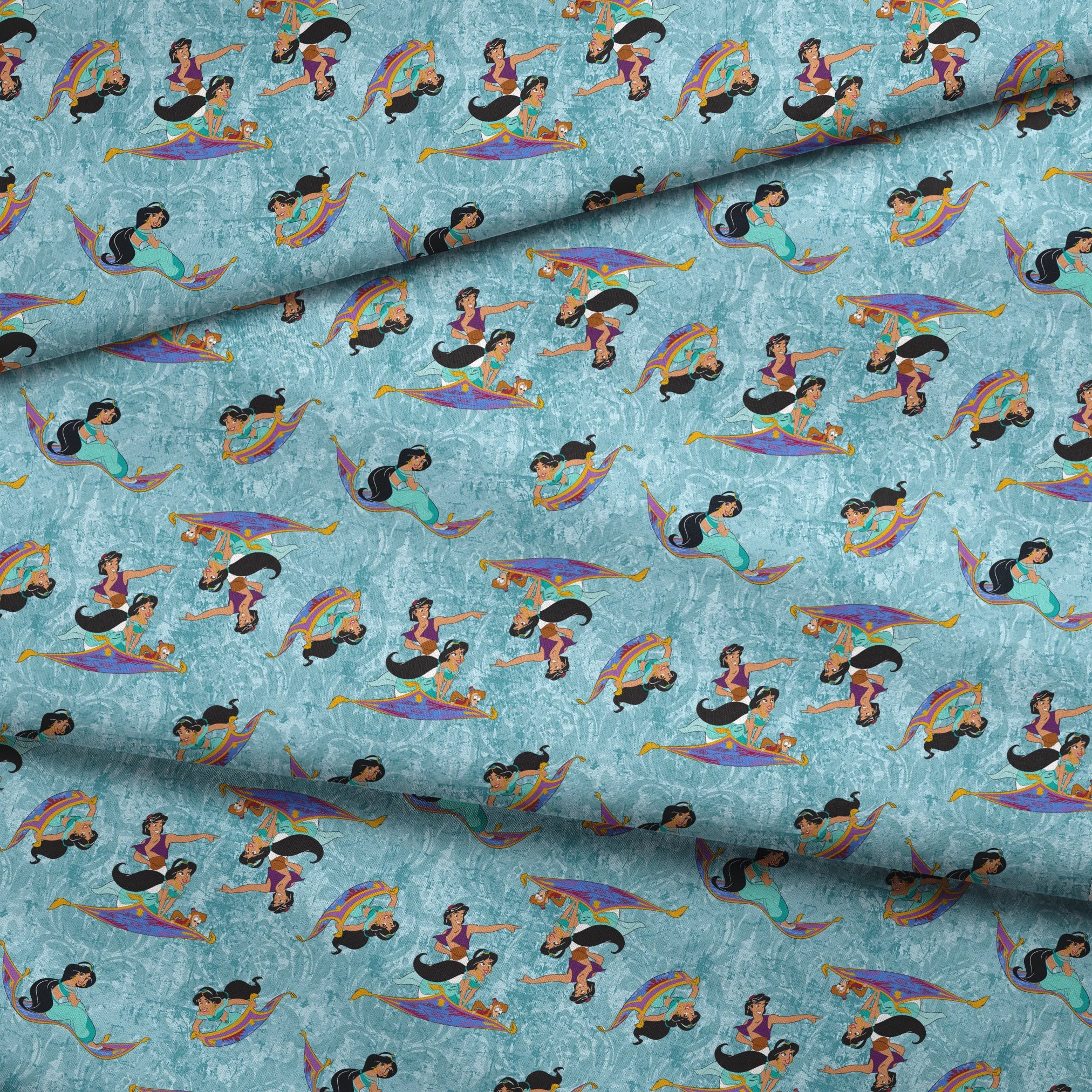 Aladdin and Princess Jasmine riding magic carpets against a light blue marbled background pattern fabric fold mockup