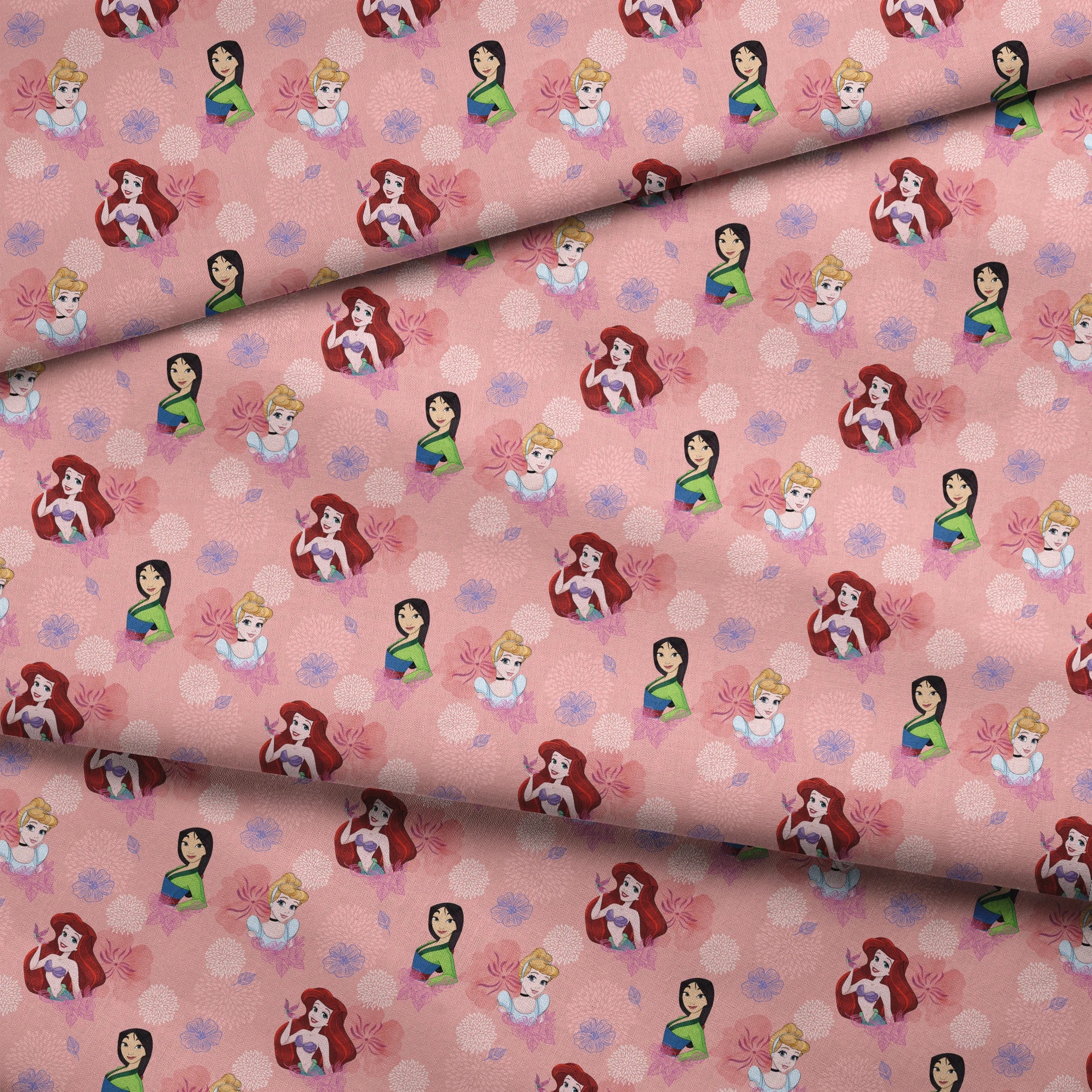 Disney princess characters on pink floral background with delicate flower patterns fabric fold mockup