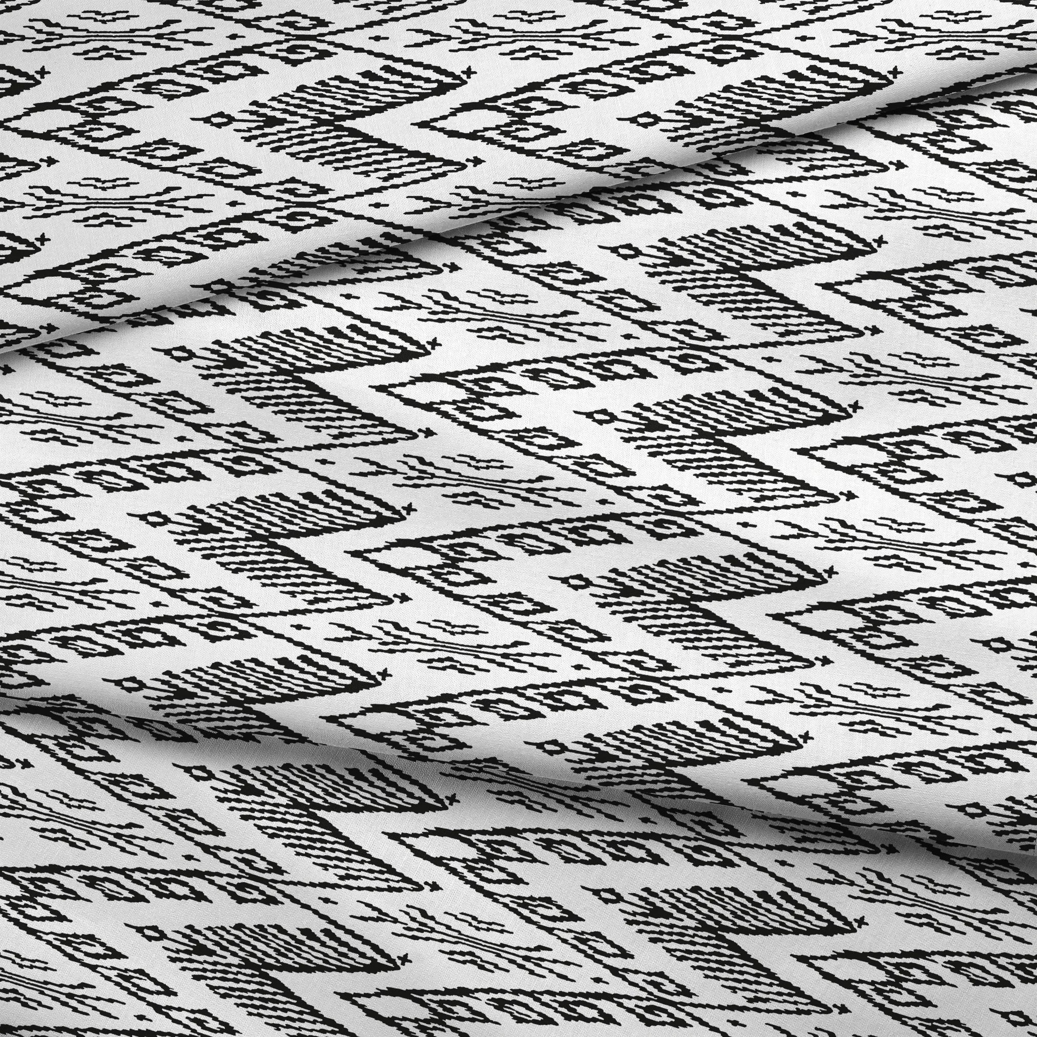 Black and white geometric pattern with diamond shapes and zigzag motifs on a textile surface fabric fold mockup