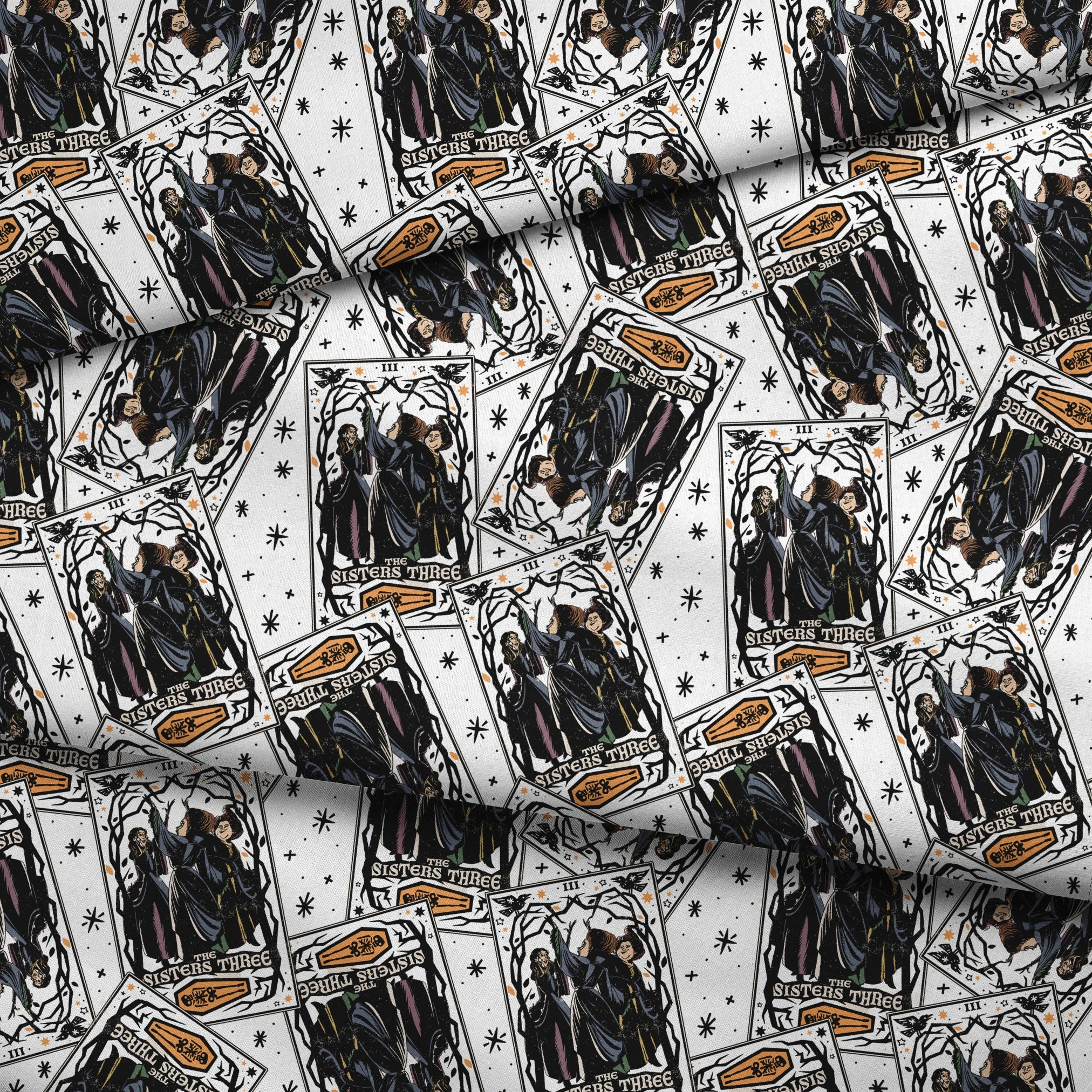 Scattered Hocus Pocus cards showing robed figures against white background with stars fabric fold mockup