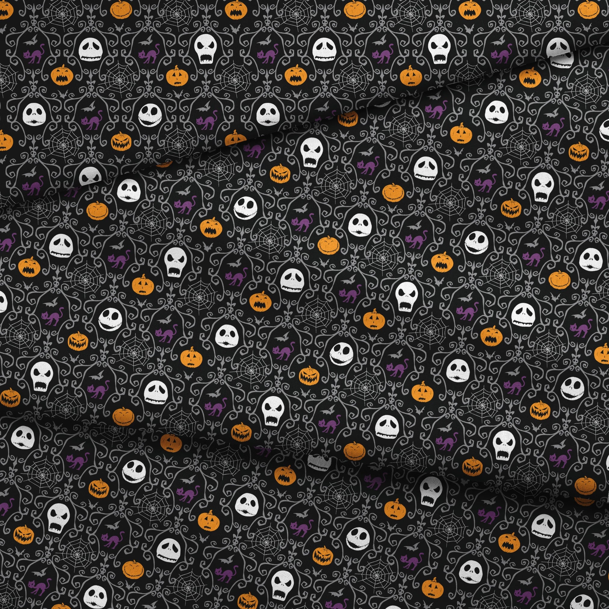 Nightmare Before Christmas pattern with skulls, pumpkins, bats and ornate swirls on black background fabric fold mockup