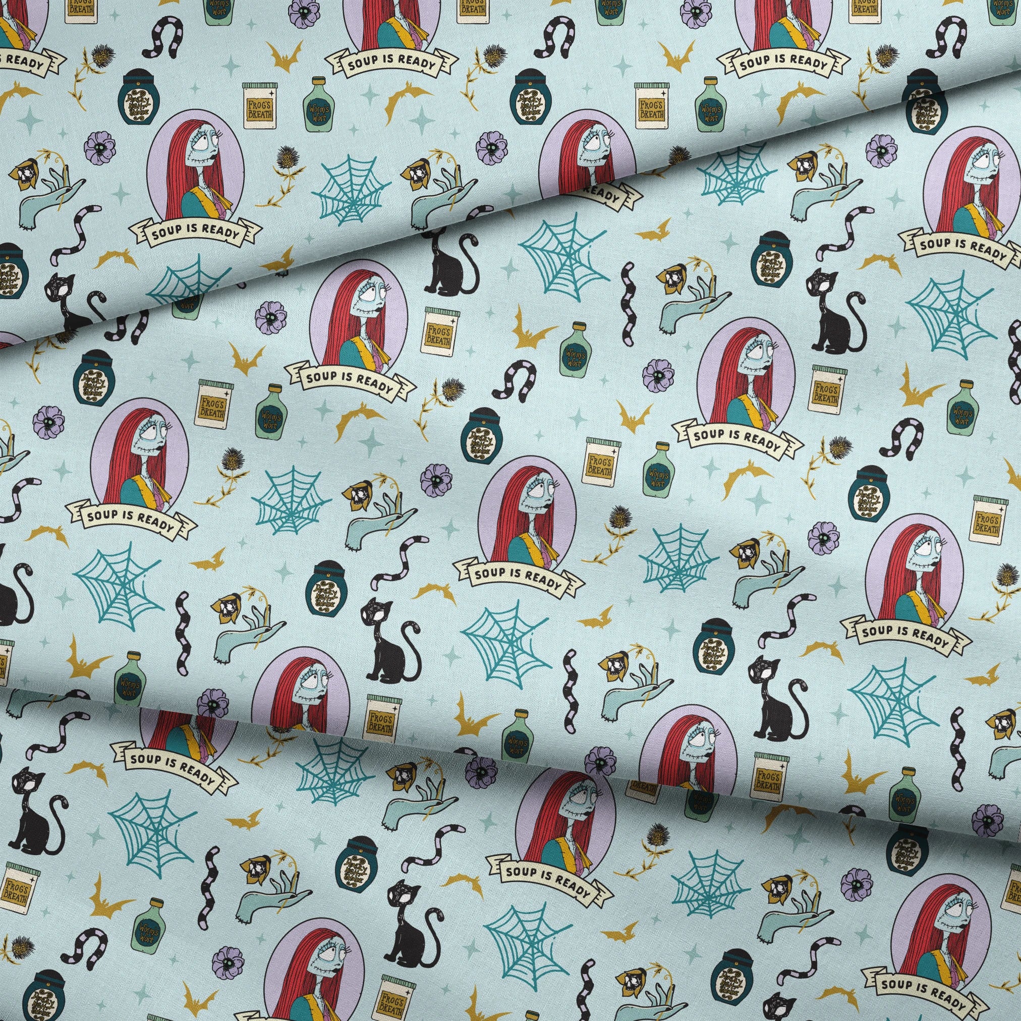 Whimsical pattern with skeletal figure in oval frame, black cats, spiderwebs, potion bottles, and "Soup is Ready" banners on light blue background. fabric fold mockup