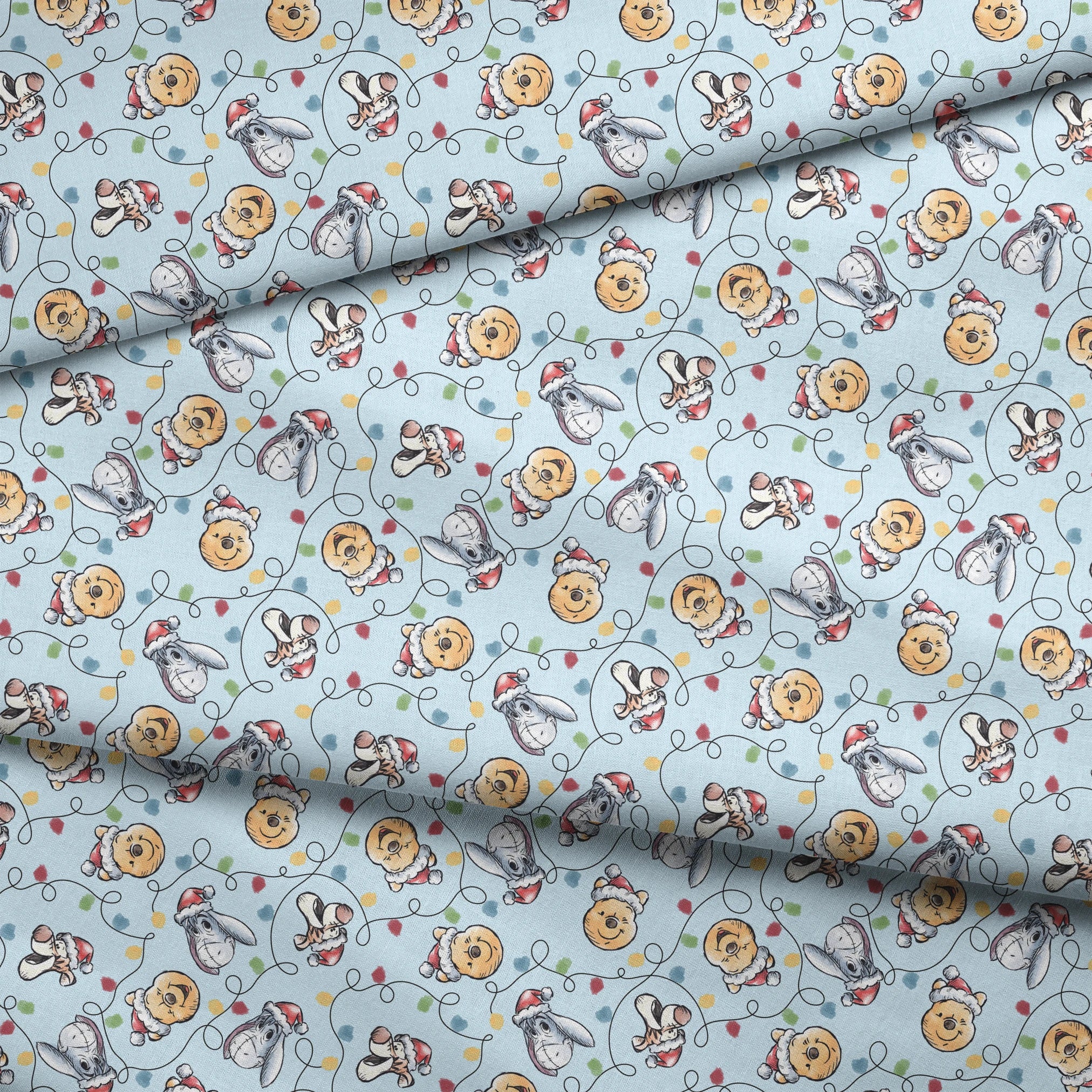 Winnie the Pooh Christmas pattern with Pooh bear, Eeyore, and Tigger in Santa hats on blue background fabric fold mockup
