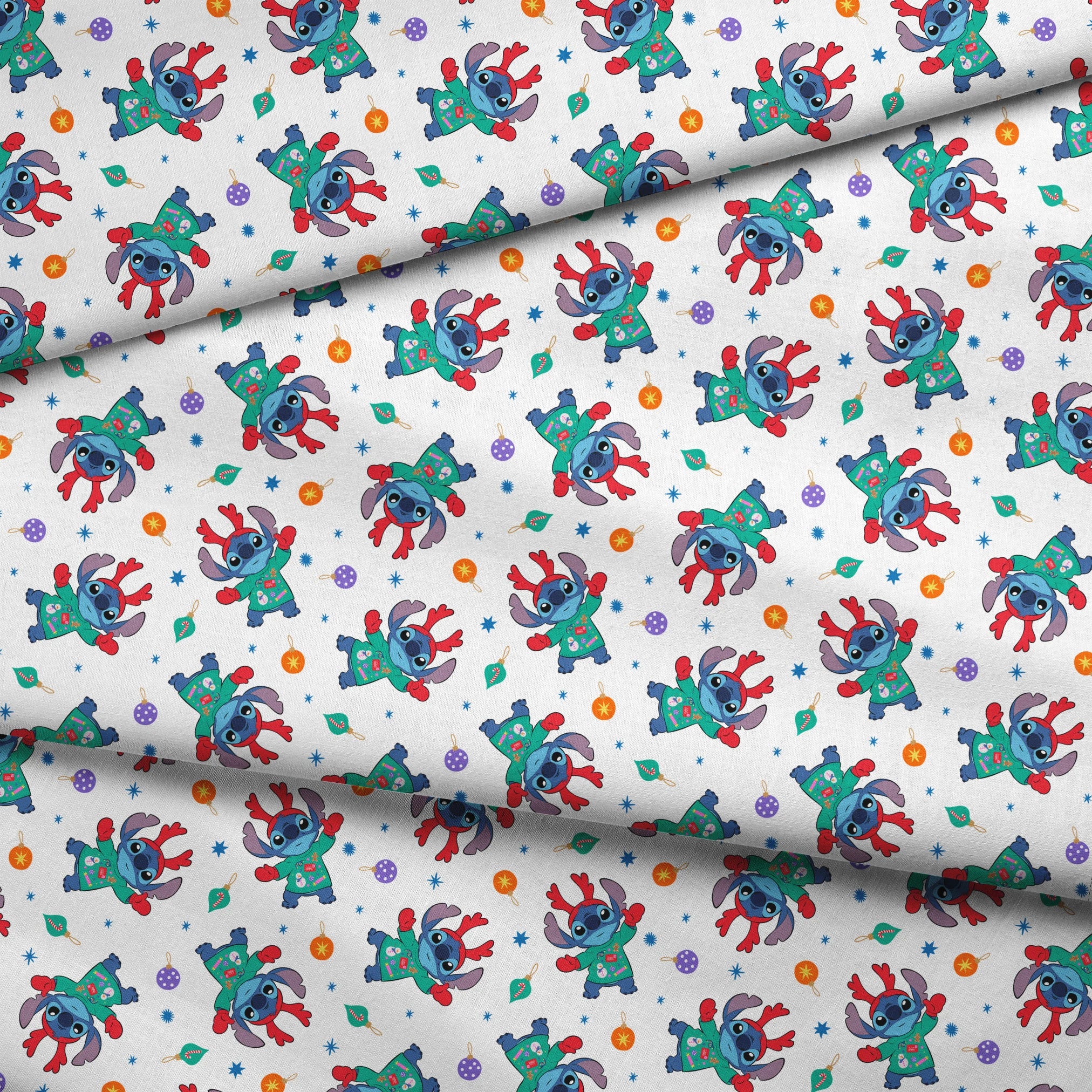 Disney's Stitch wearing green Christmas sweater and red scarf in repeating pattern with ornaments and stars. fabric fold mockup