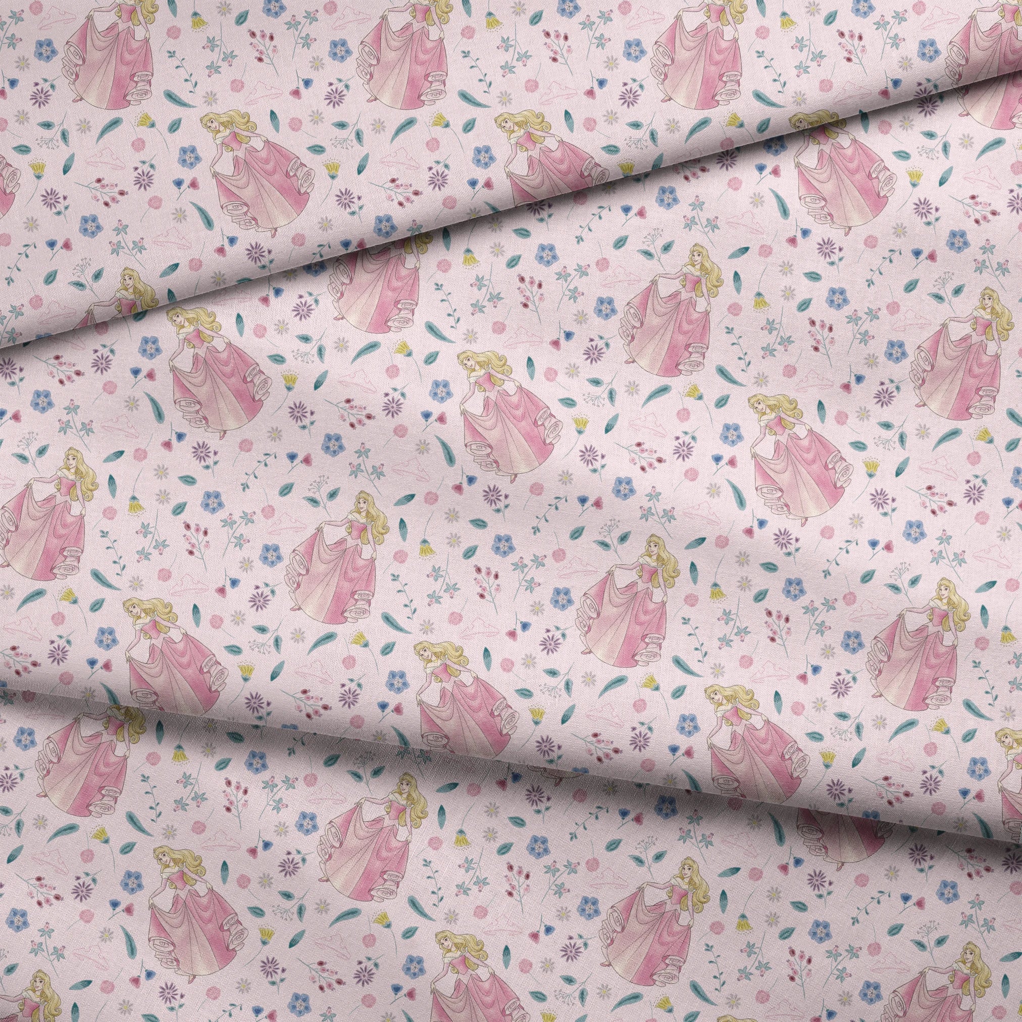 Disney's Sleeping Beauty surrounded by scattered flowers and leaves on light pink background fabric fold mockup