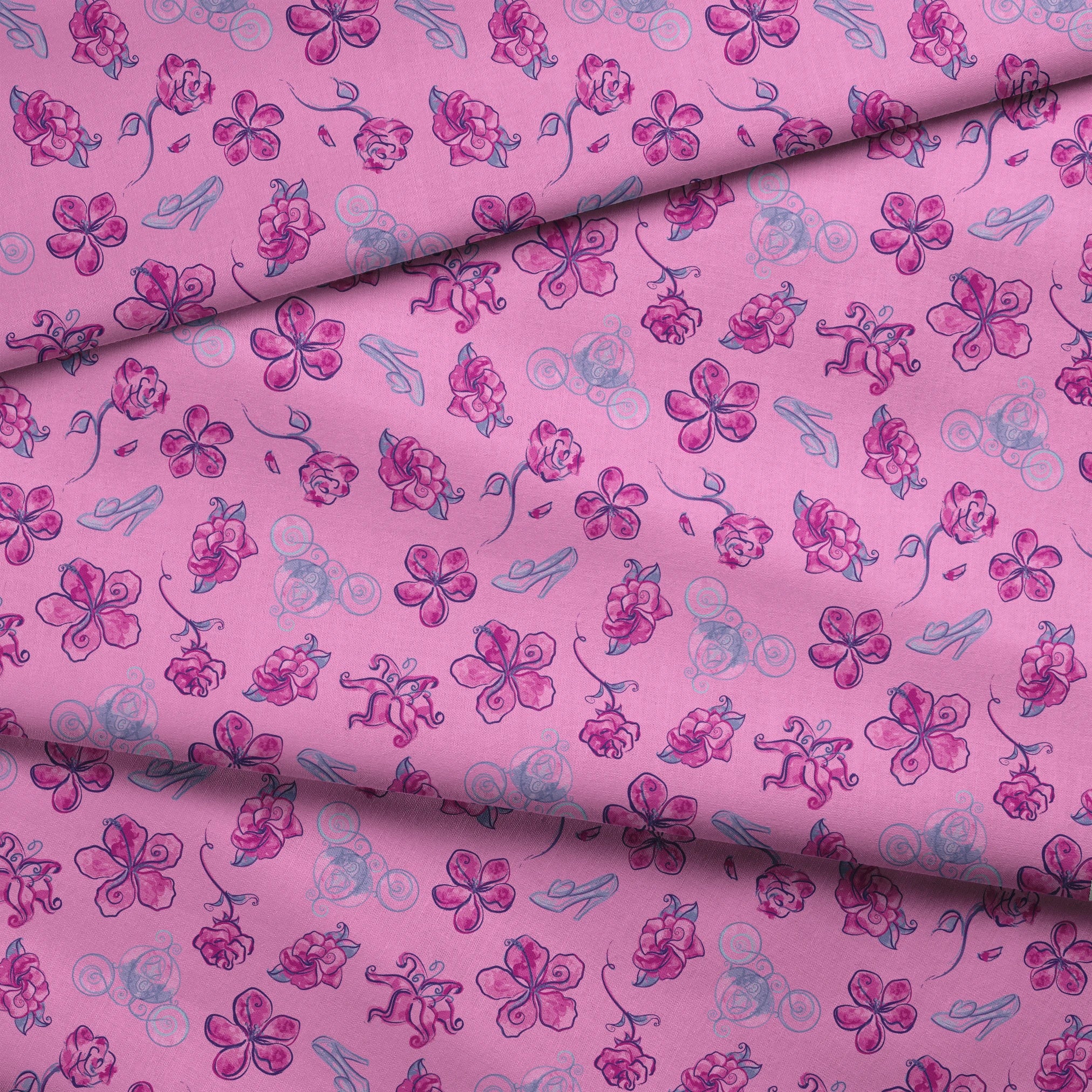 Whimsical Cinderella pattern of purple flowers, roses, and glass slipper outlines on pink background fabric fold mockup