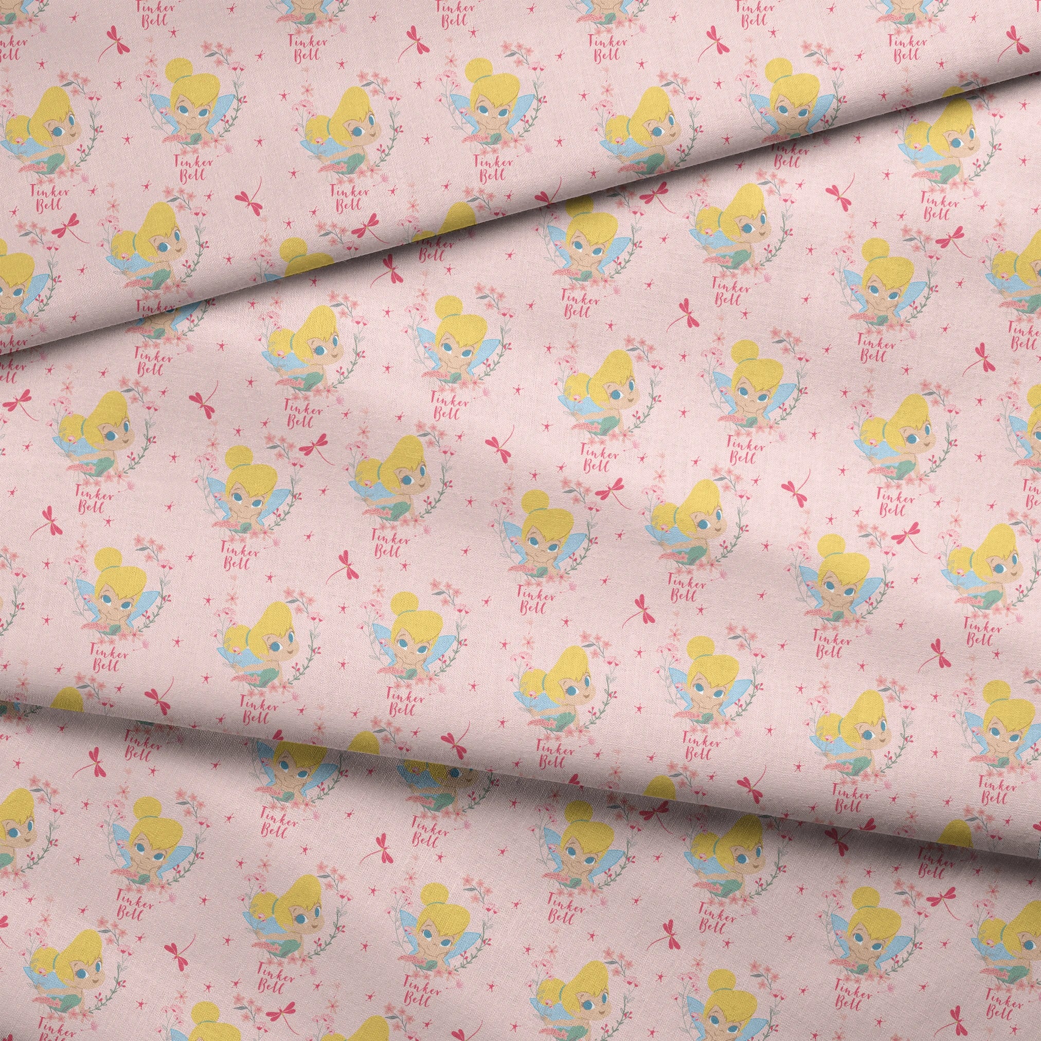 Pink background with Tinker Bell surrounded by flowers, stars, and dragonflies fabric fold mockup