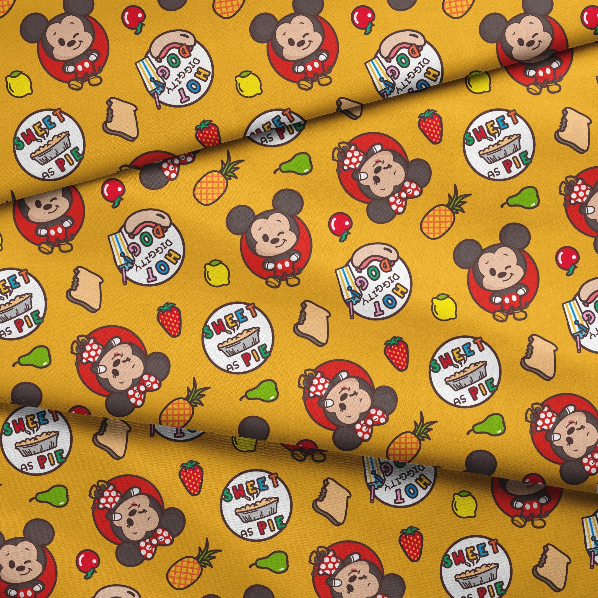 Mickey & Minnie Mouse with round badges on yellow background with fruit icons and toast patterns fabric fold mockup