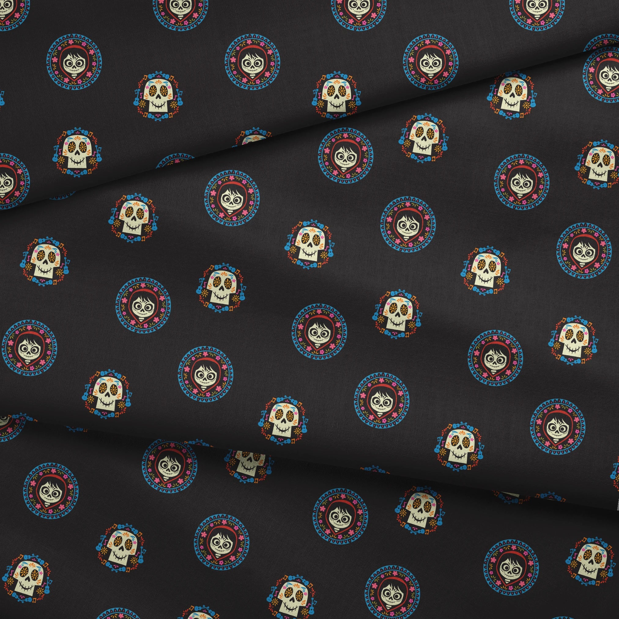 Colorful Coco sugar skull pattern with decorative circular borders on black background fabric fold mockup