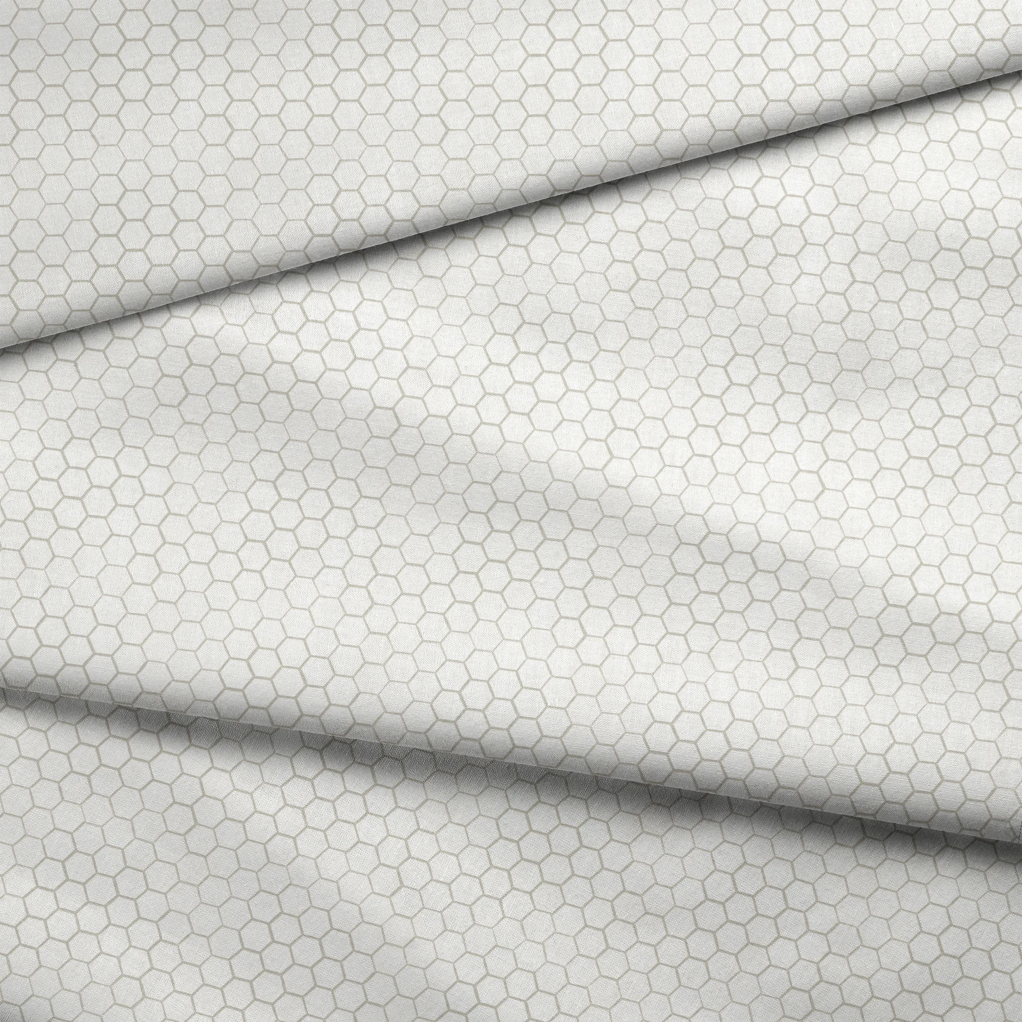 White and beige honeycomb pattern fabric designed by Nicole Tamarin with a subtle, modern farmhouse style. fabric fold mockup