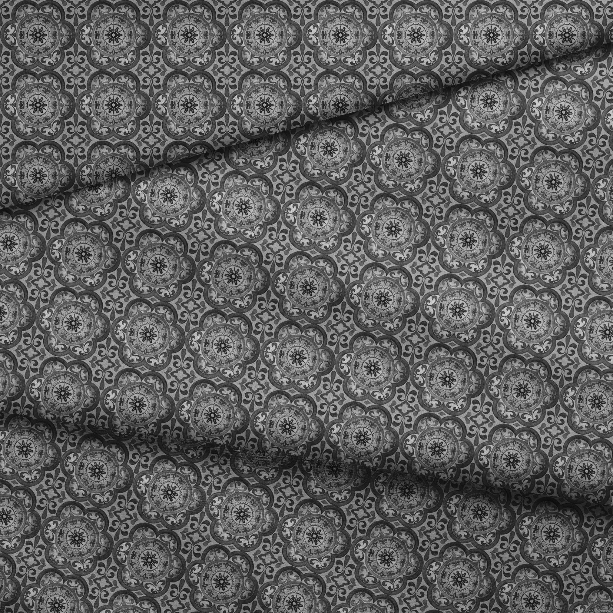 Grayscale medallion tile pattern with floral and scroll motifs in a symmetrical layout by Nicole Tamarin. fabric fold mockup