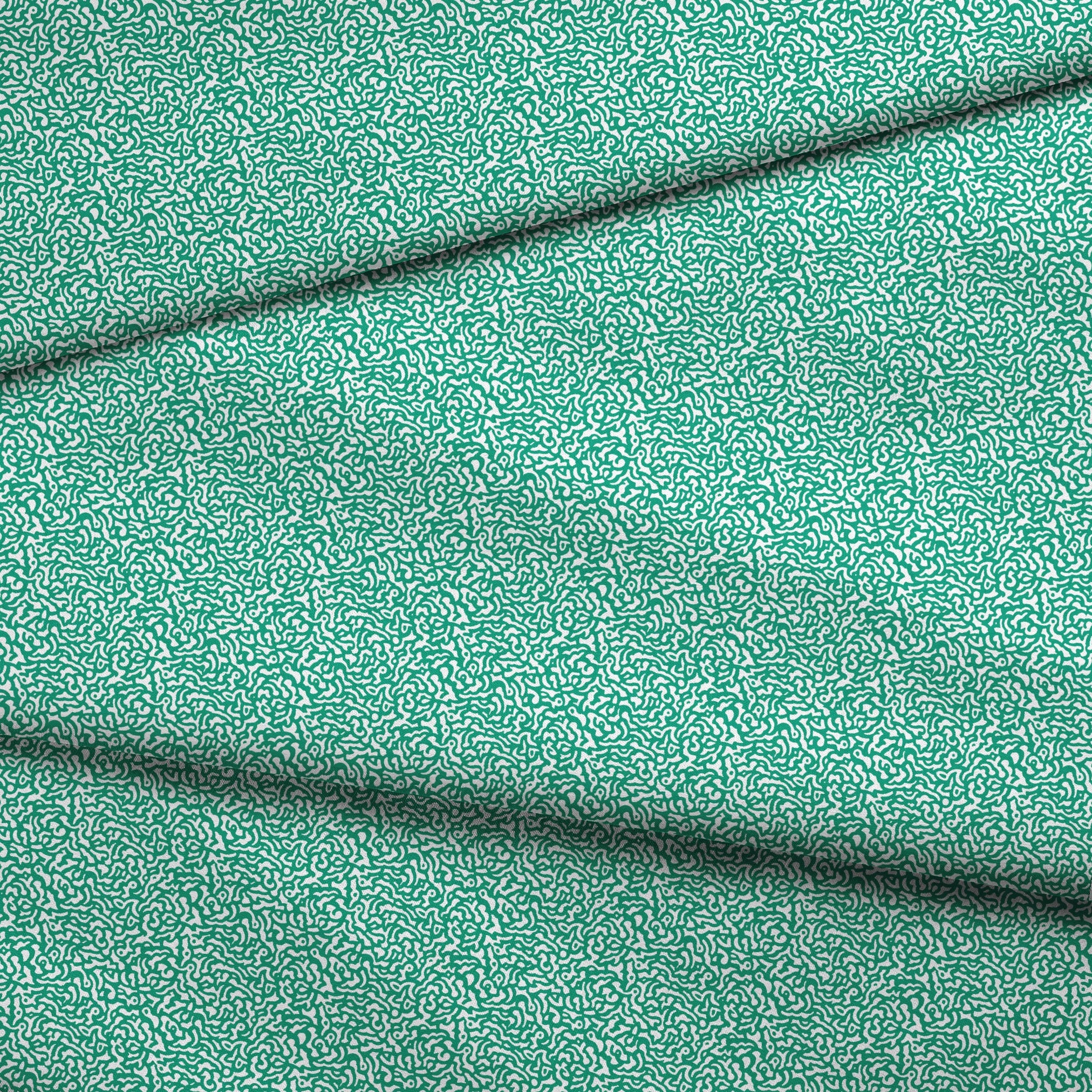 Abstract green and white pattern with organic swirling lines resembling coral or brain-like formations fabric fold mockup