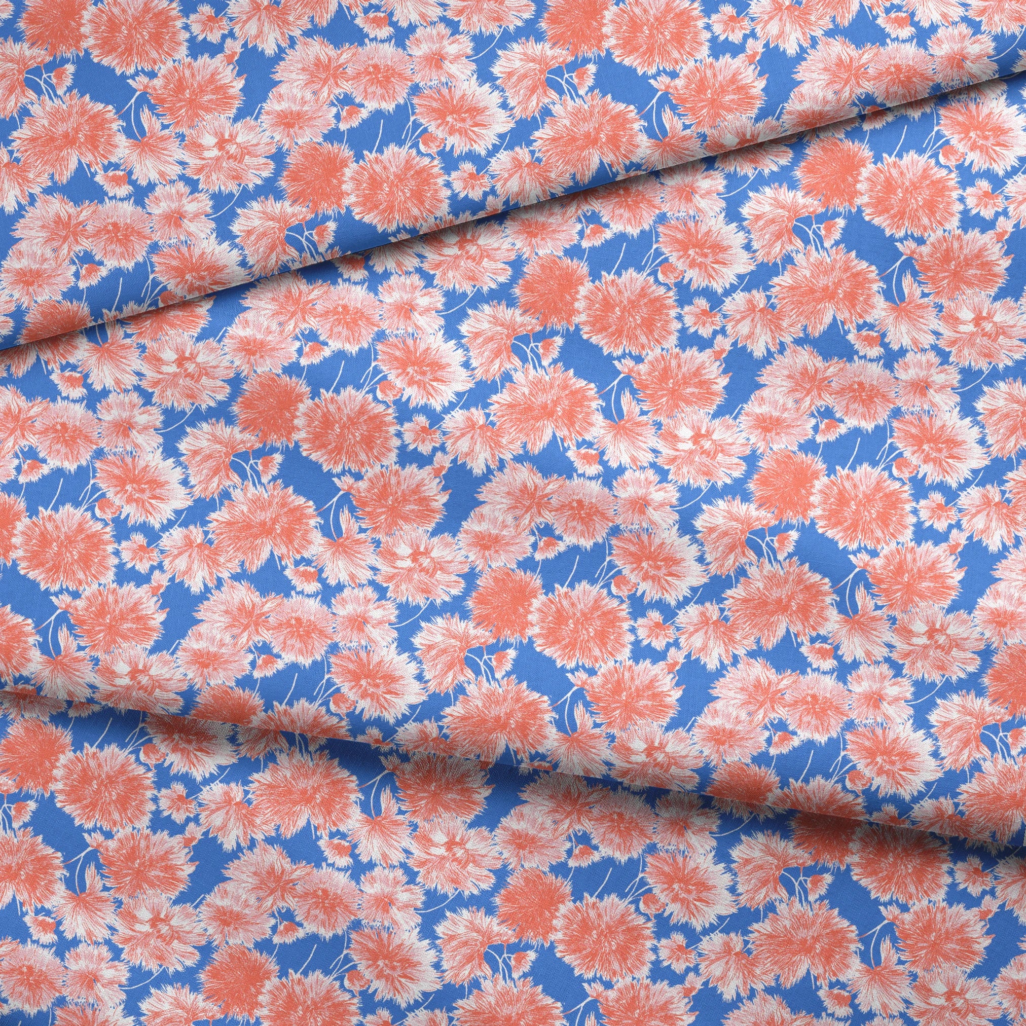 Coral pink floral pattern of chrysanthemums or dahlias on bright blue background fabric fold mockup