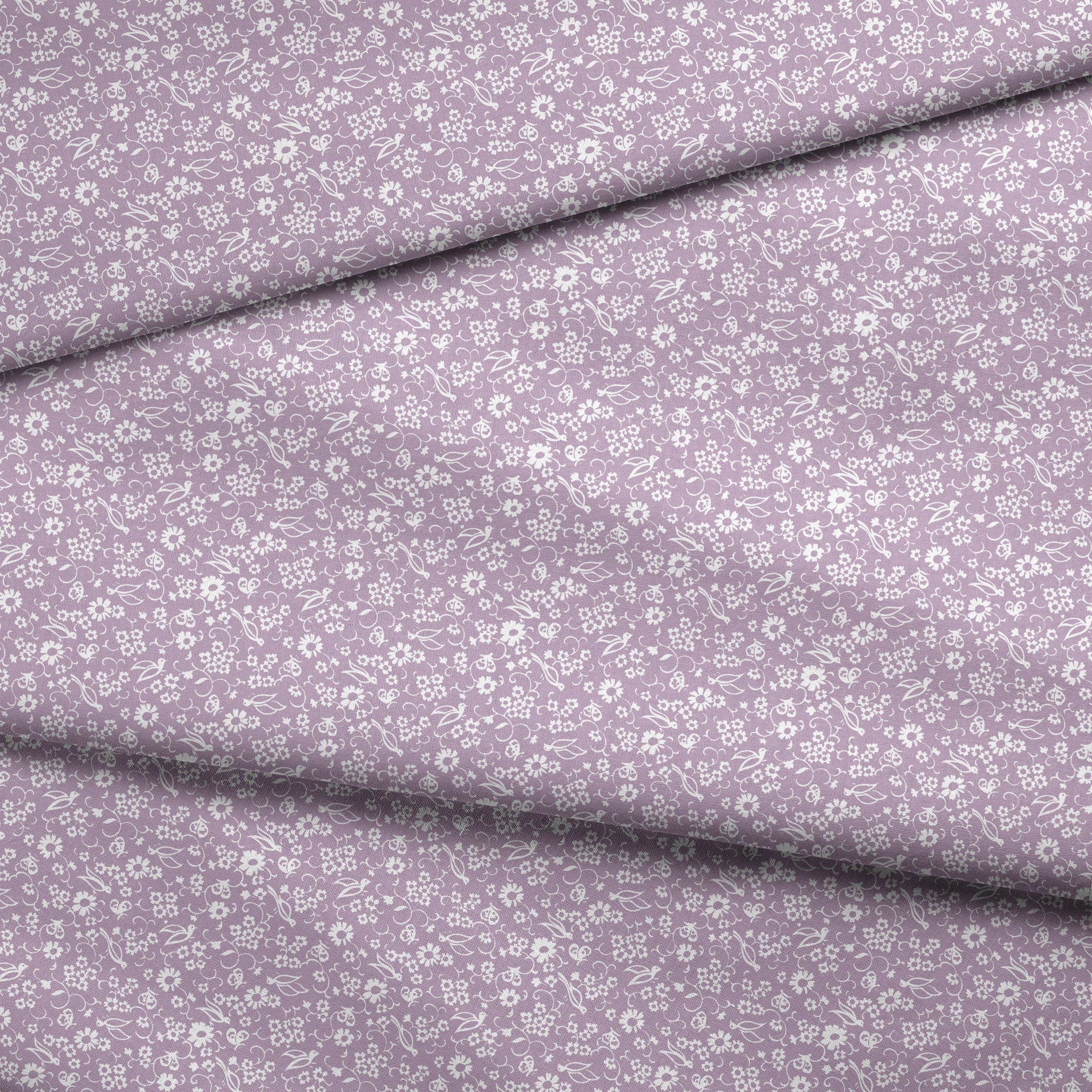 White floral pattern on lavender purple background with daisies and decorative swirls fabric fold mockup
