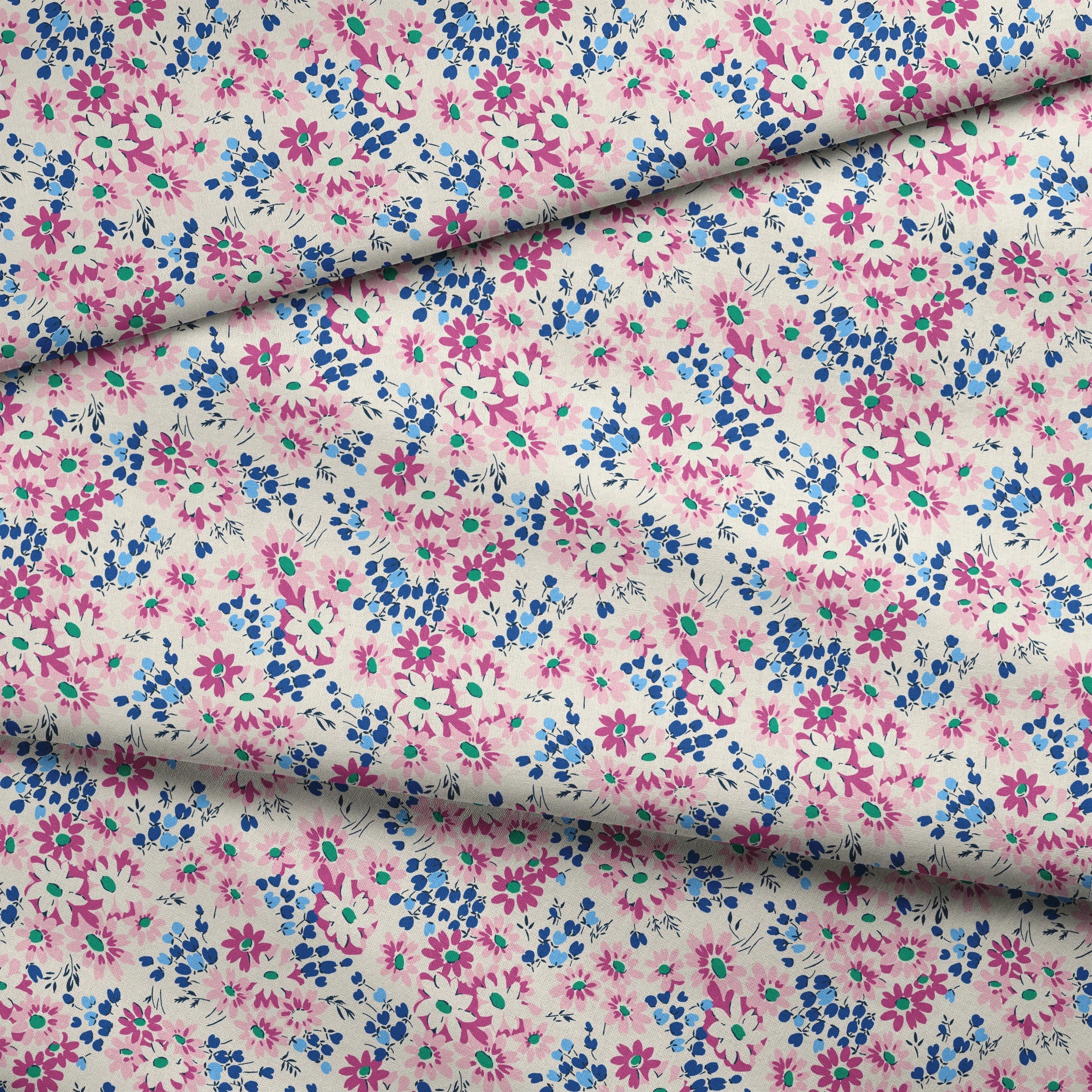 Colorful floral pattern with pink and magenta daisies, blue berries, and green accents on cream background fabric fold mockup
