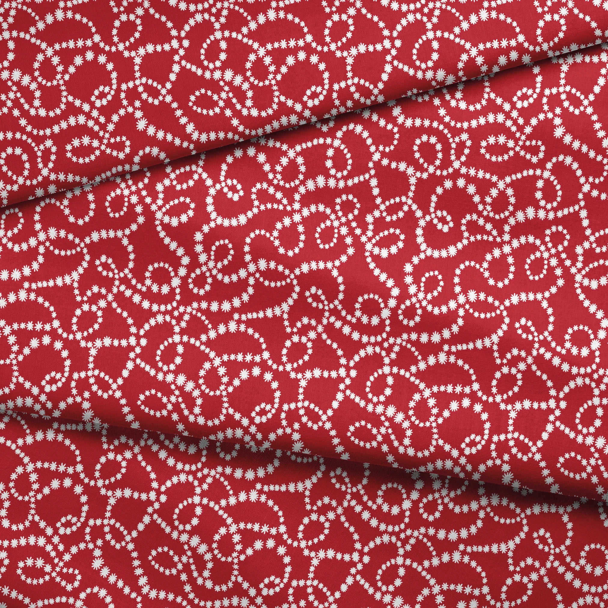 White dotted swirl pattern on rich red background creating decorative curving lines fabric fold mockup