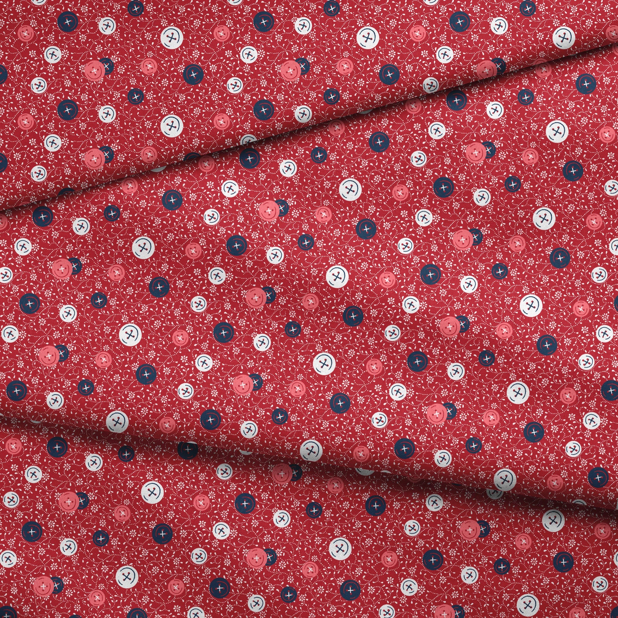 Red background with scattered buttons in white, blue, and coral colors featuring sewing motifs and small floral patterns fabric fold mockup