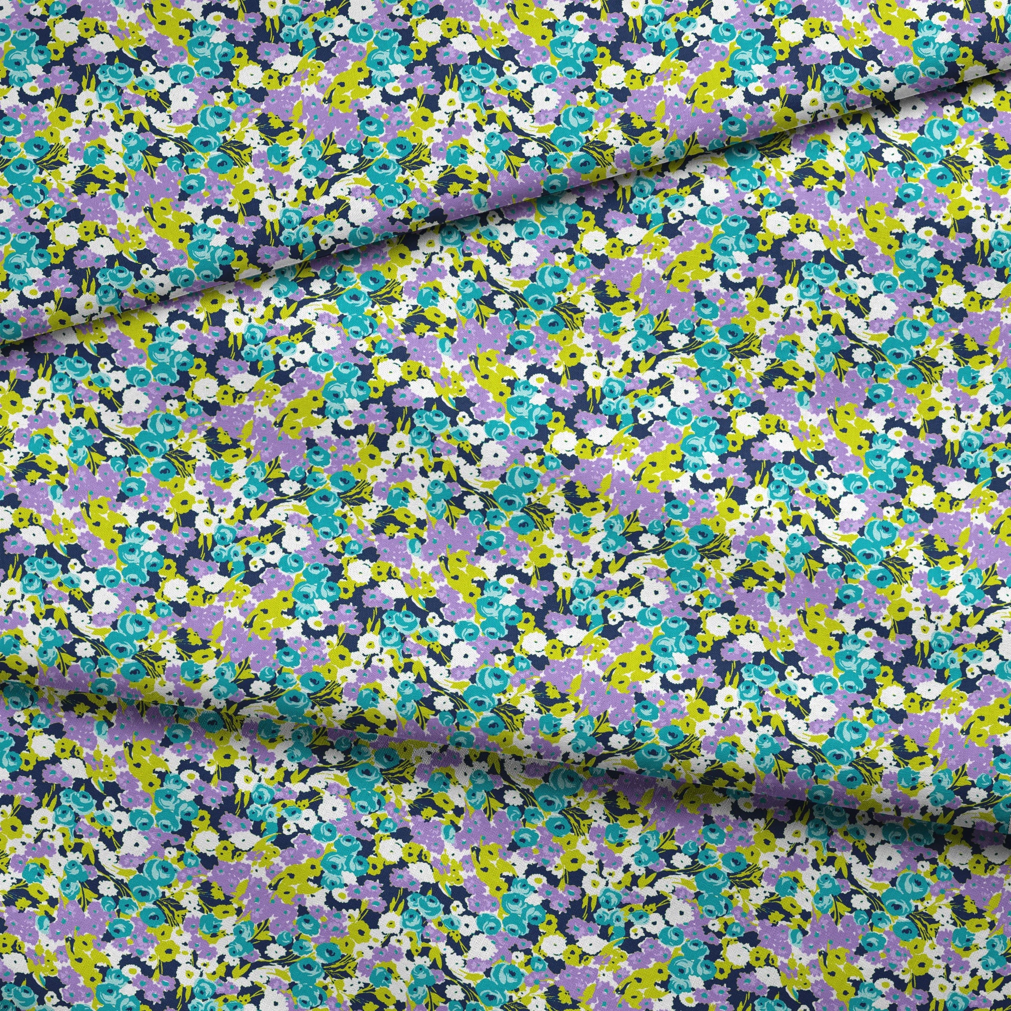 Vibrant floral pattern with turquoise, purple, white, and chartreuse blooms on dark background fabric fold mockup
