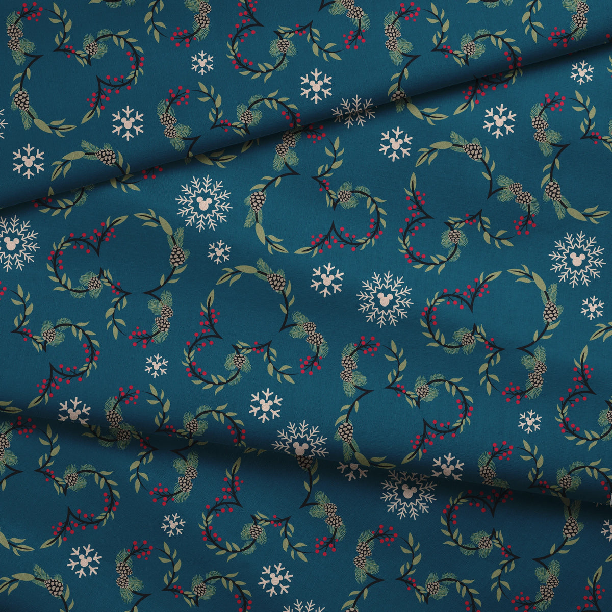 Holiday pattern with circular wreaths, white snowflakes, and botanical elements on teal background fabric fold mockup