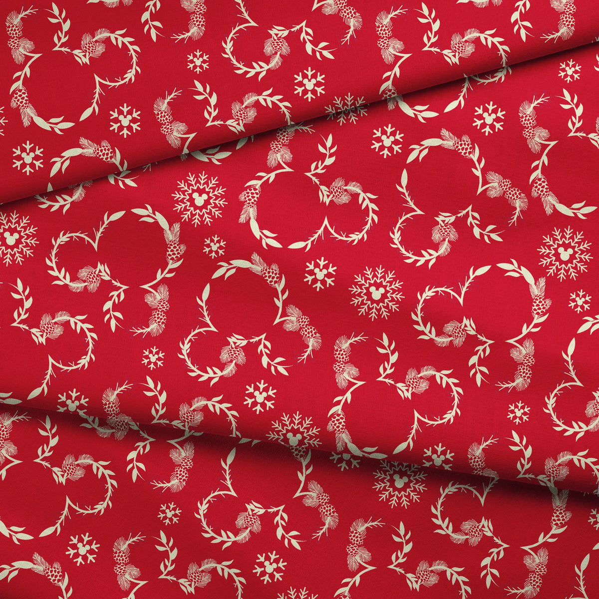 Festive red background with white floral wreaths, pine cones, and snowflake patterns fabric fold mockup