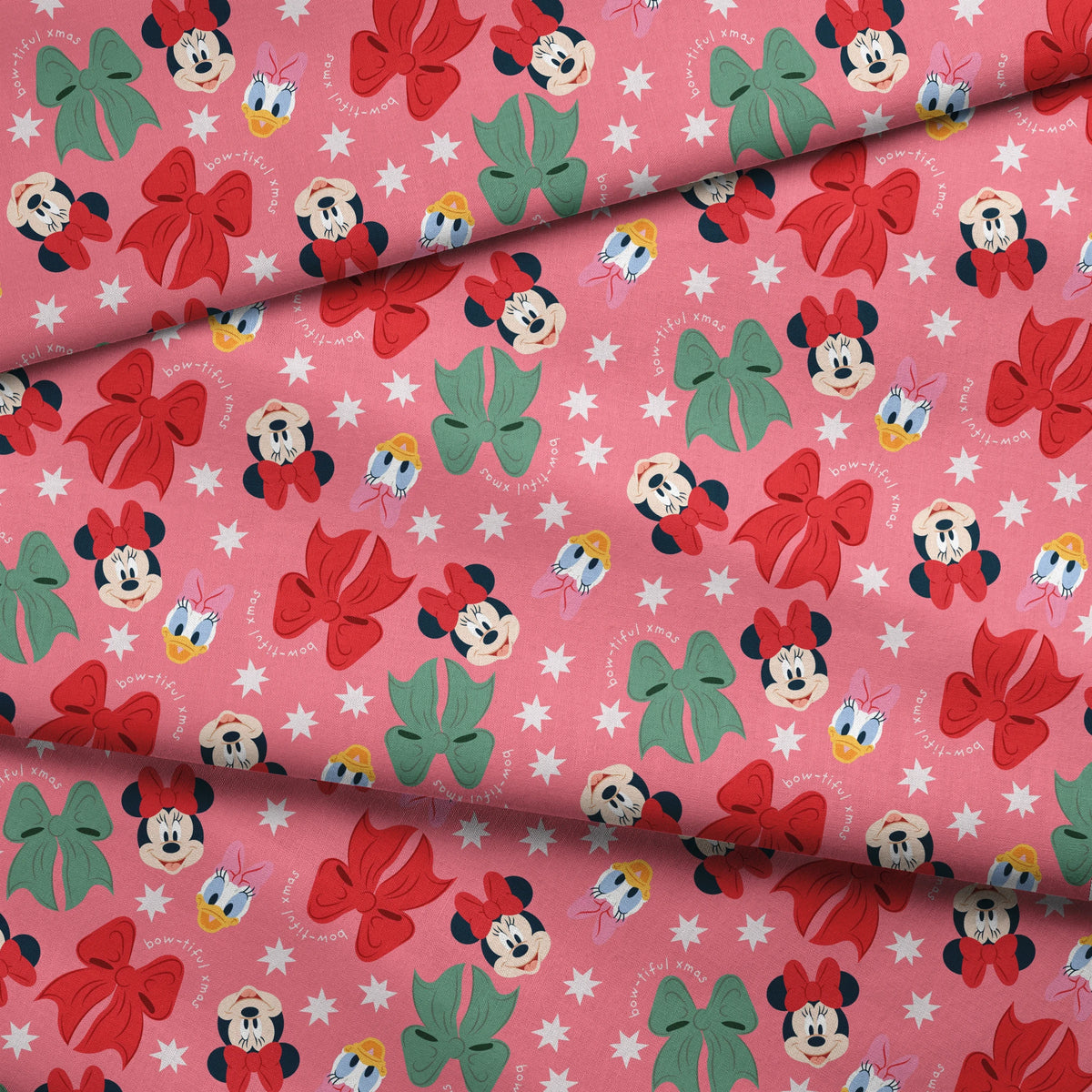 Disney character pattern with Mickey and Minnie Mouse, Donald Duck, bows in red and green on pink background with white stars fabric fold mockup