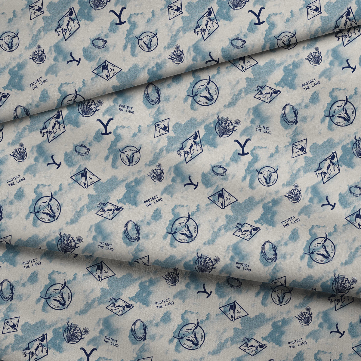 Paramount Yellowstone Icons in the Clouds on Blue Fabric