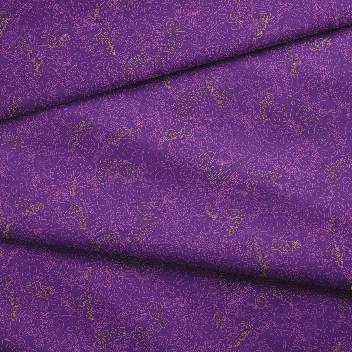 Paramount Grease  Title Toss on Purple Fabric