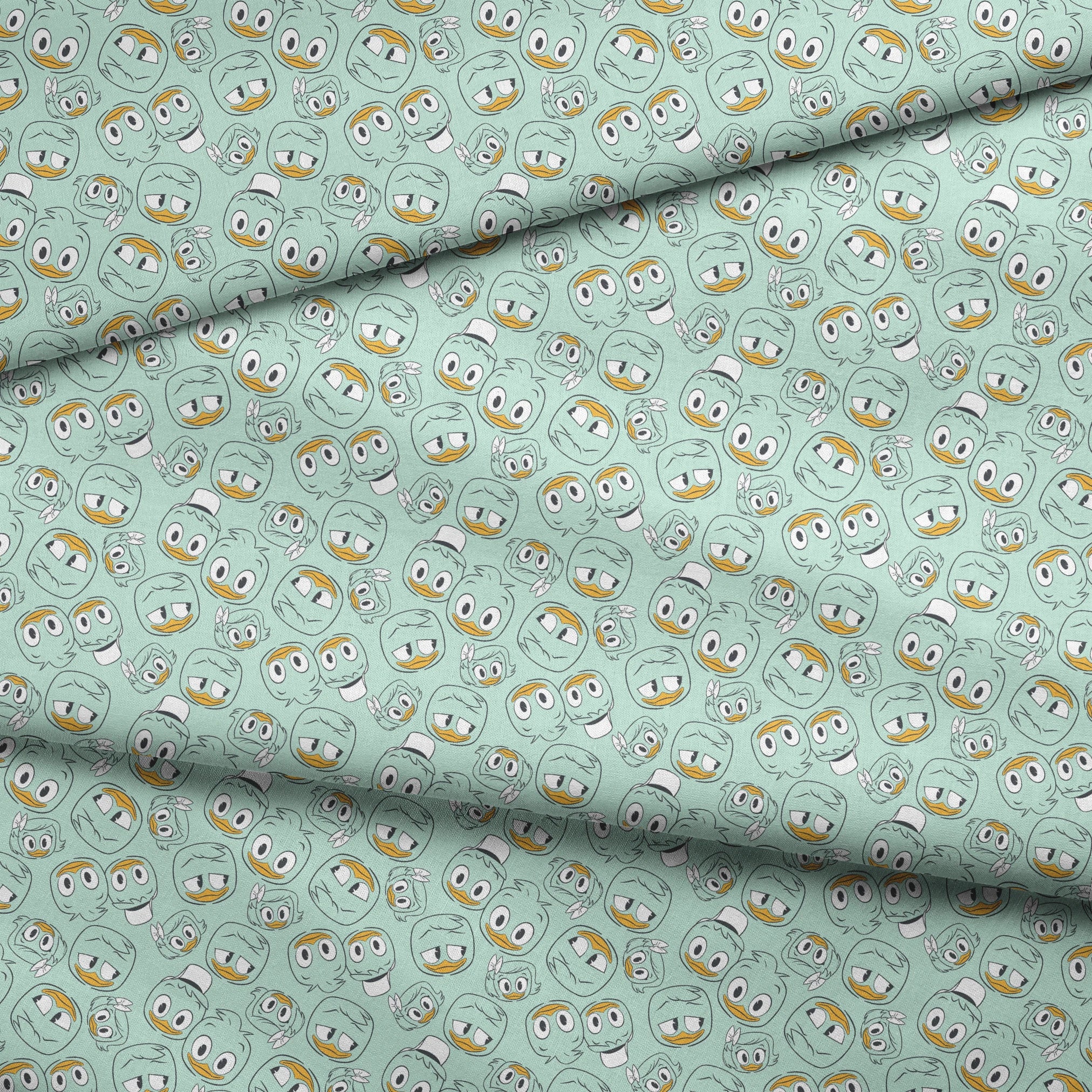 Disney Duck Tales Character Faces on Mint Fabric