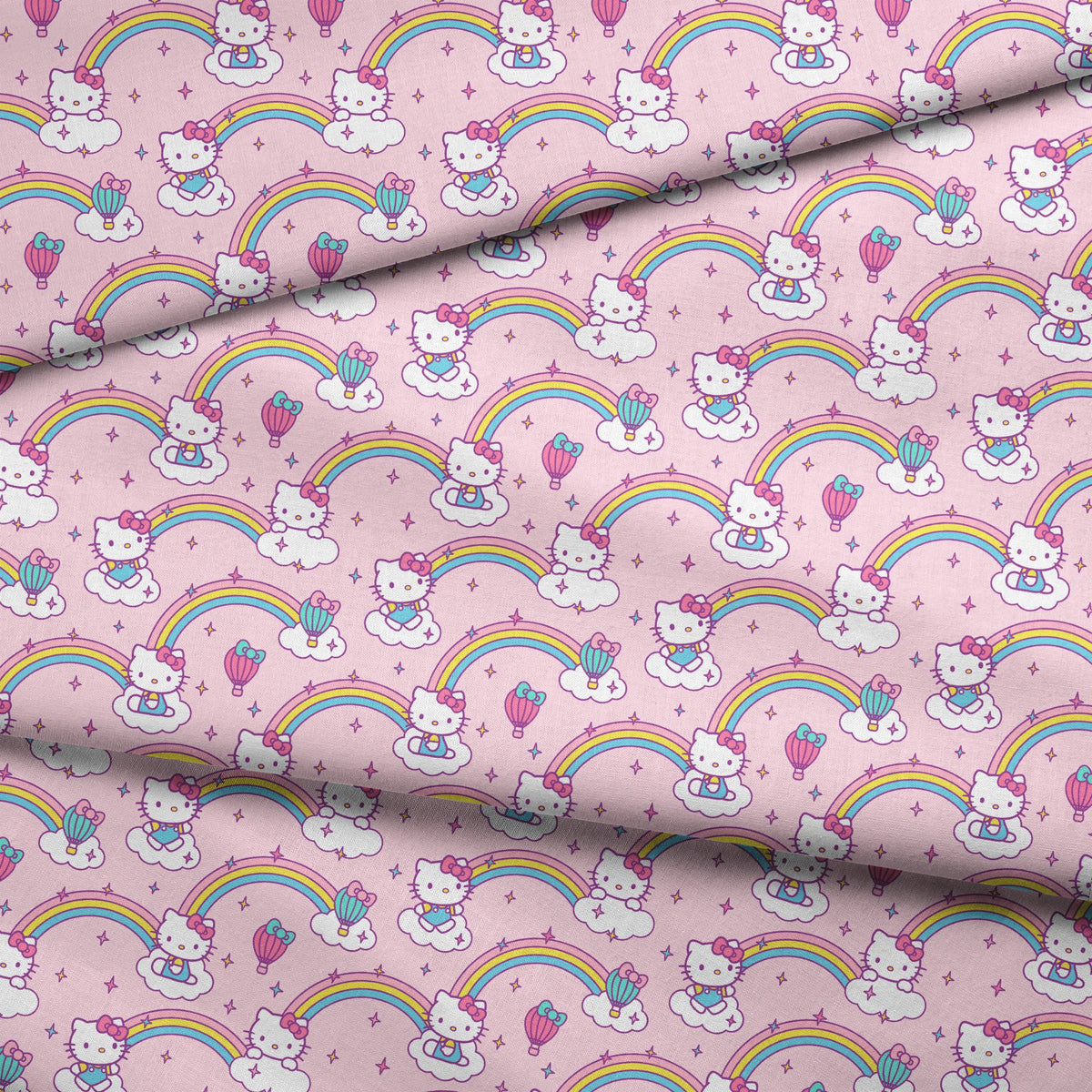 Hello Kitty® Rainbows & Clouds on Pink Fabric