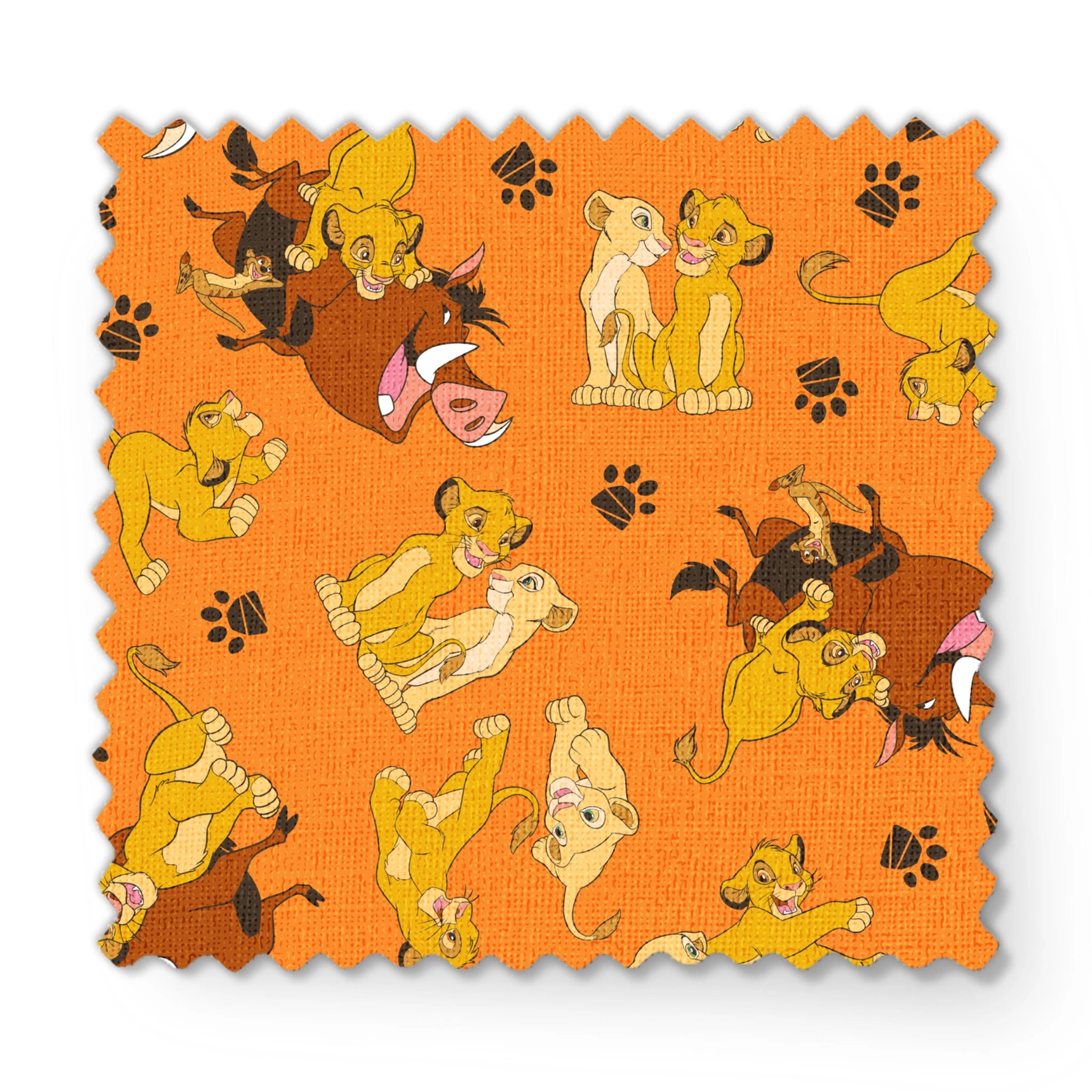 Playful pattern of cartoon cubs in yellow and brown poses on bright orange background with pawprints fabric swatch mockup