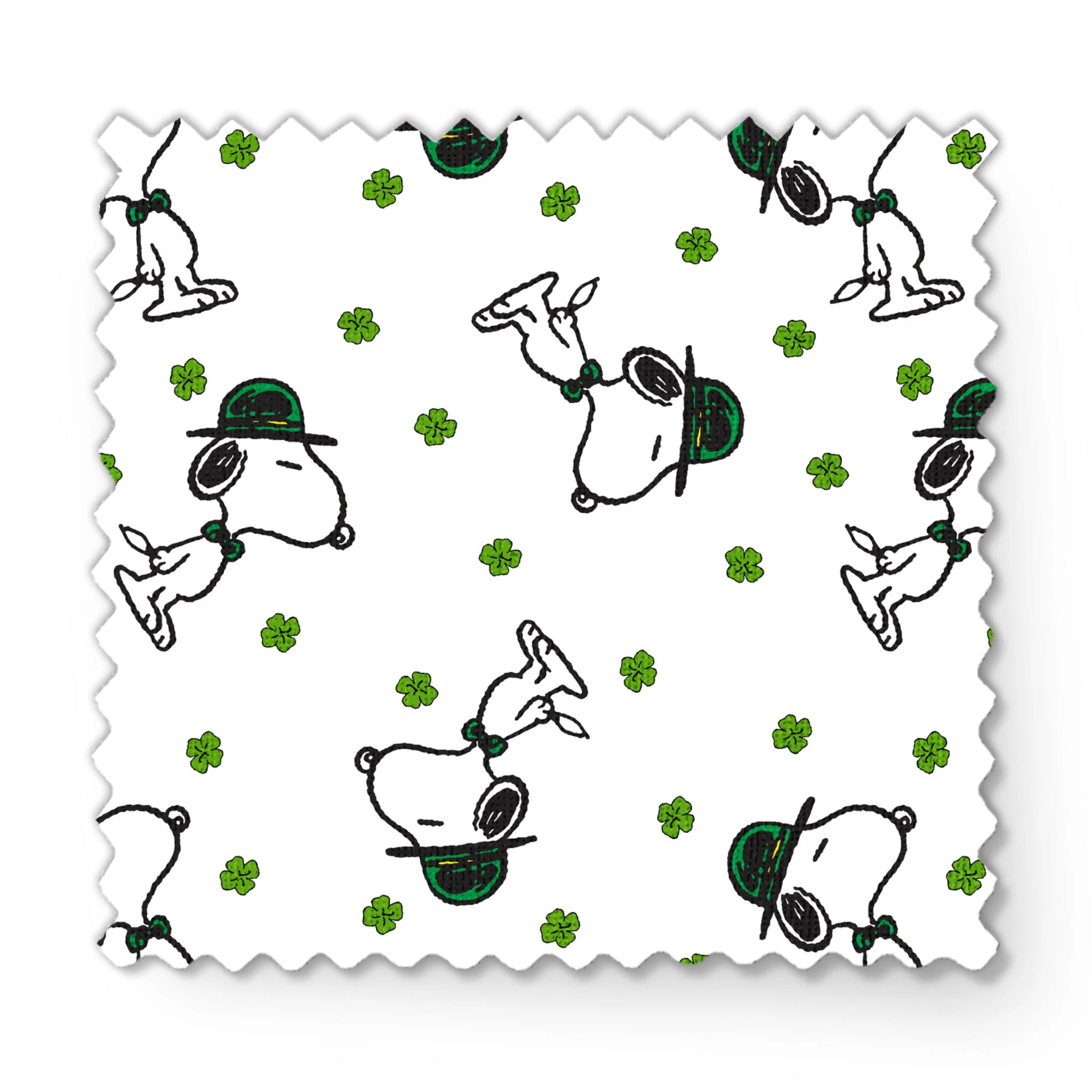 Cartoon Snoopy wearing green hat with shamrocks scattered across white background fabric swatch mockup