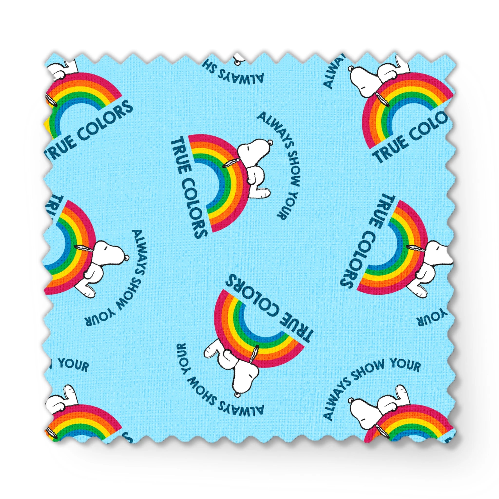 Rainbow Snoopy pattern on light blue background with white clouds and "TRUE COLORS" and "ALWAYS SHOW YOUR" text repeated throughout design fabric swatch mockup