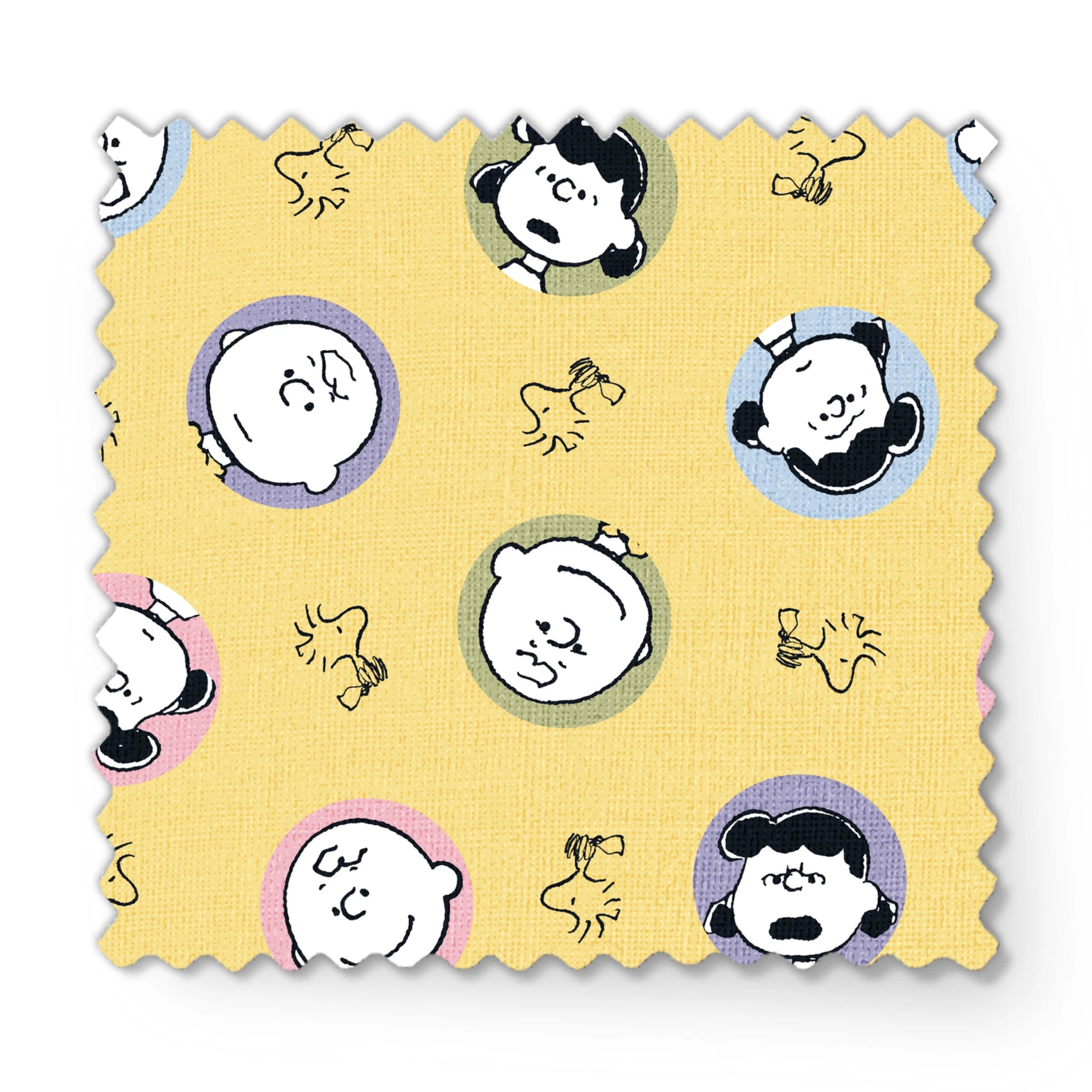 Peanuts characters pattern with Charlie Brown and friends in circular frames on yellow background with Woodstock silhouettes fabric swatch mockup